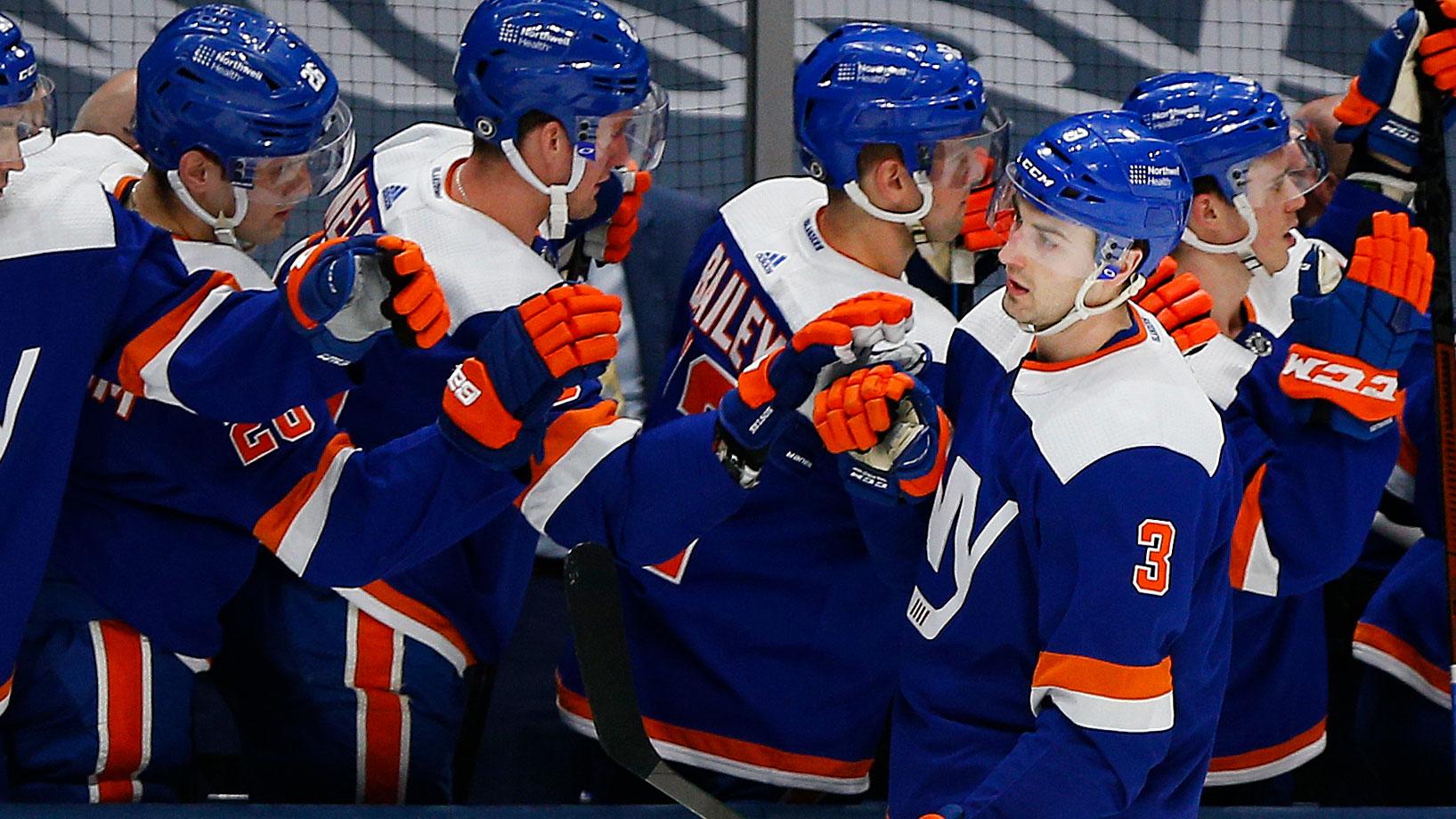 Mar 11, 2021; Uniondale, New York, USA; New York Islanders defenseman Adam Pelech (3) is congratulated after scoring a goal against the New Jersey Devils during the first period at Nassau Veterans Memorial Coliseum.