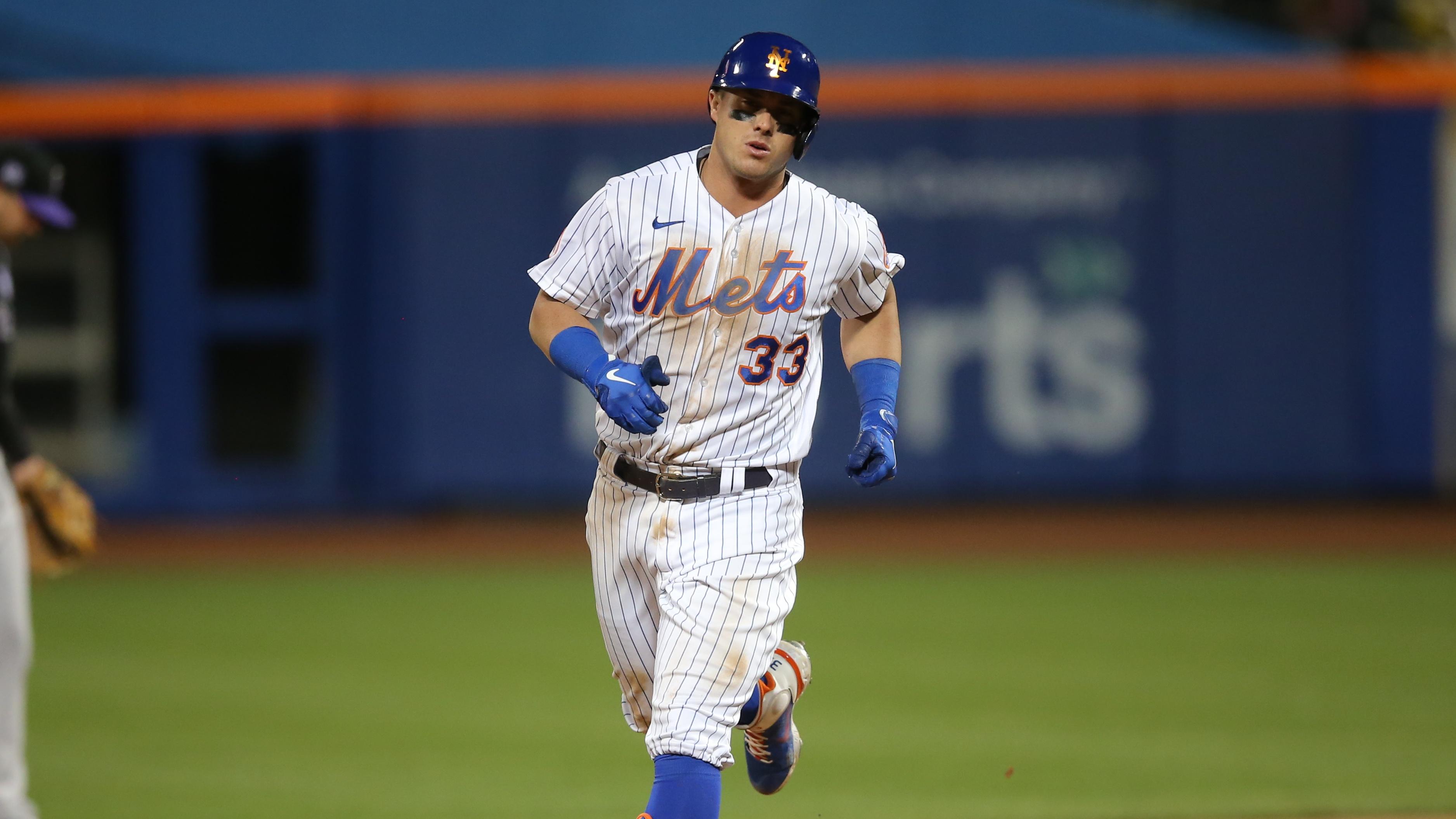 May 24, 2021; New York City, New York, USA; New York Mets first baseman James McCann (33) rounds the bases after hitting a solo home run against the Colorado Rockies during the seventh inning at Citi Field.