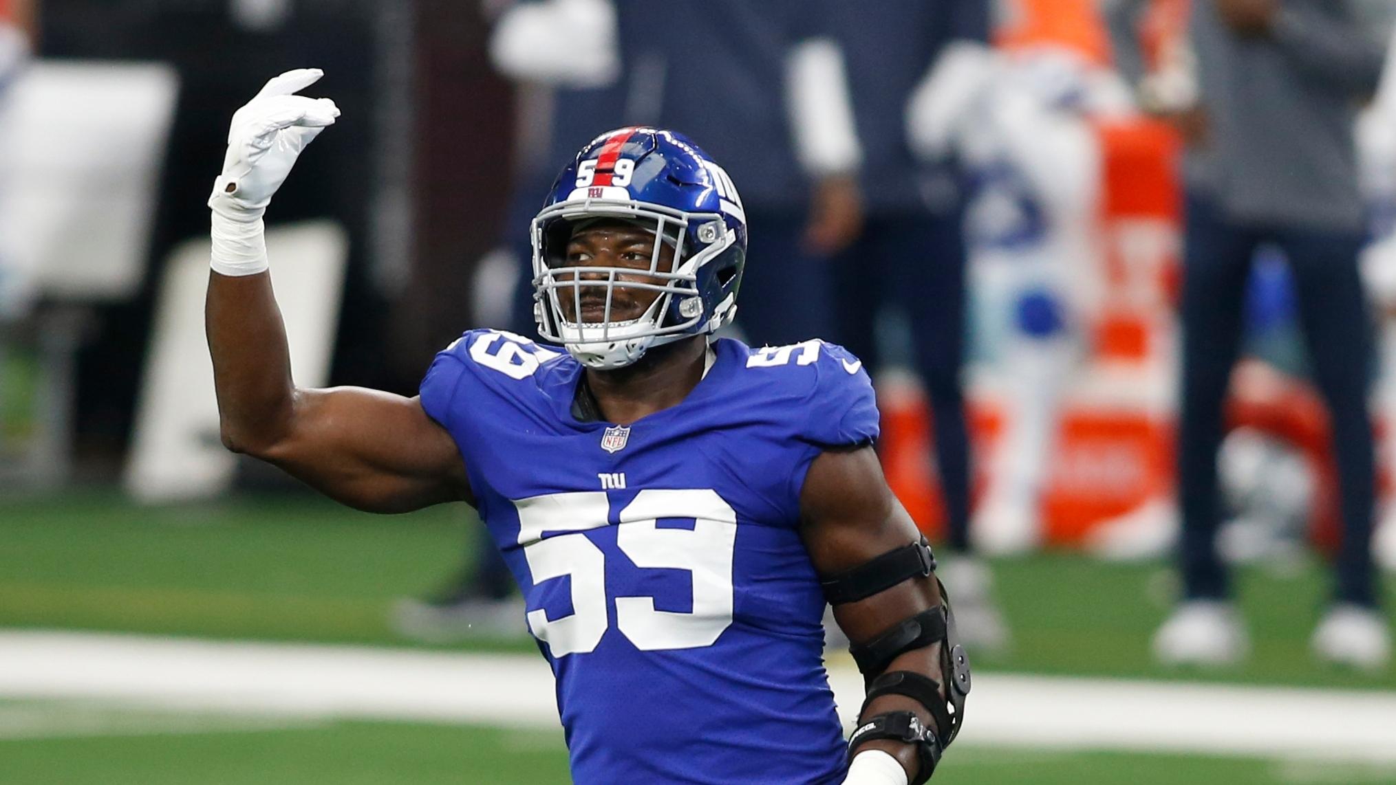 New York Giants outside linebacker Lorenzo Carter (59) in injured in the first quarter against the Dallas Cowboys at AT&T Stadium.