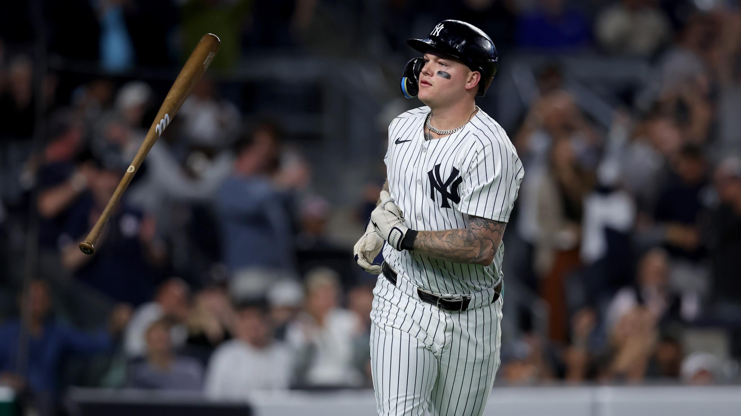 Sep 9, 2024; Bronx, New York, USA; New York Yankees left fielder Alex Verdugo (24) flips his bat after hitting a two run home run against the Kansas City Royals during the fourth inning at Yankee Stadium.