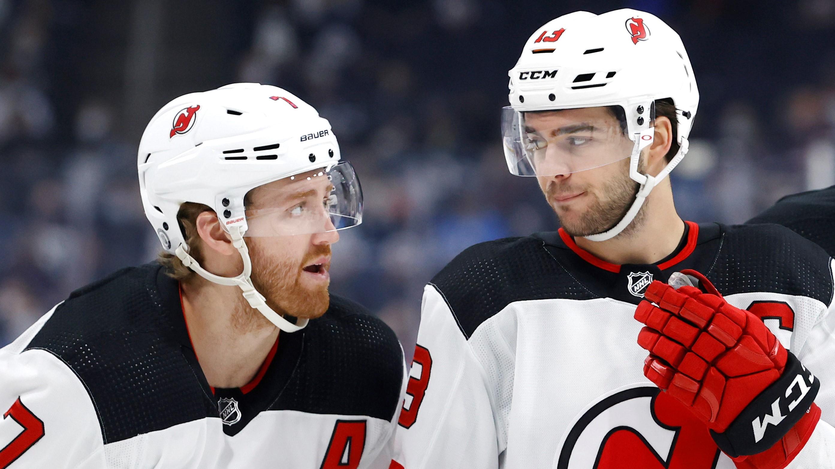 Dec 3, 2021; Winnipeg, Manitoba, CAN; New Jersey Devils defenseman Dougie Hamilton (7), New Jersey Devils center Nico Hischier (13) and New Jersey Devils defenseman Ryan Graves (33) talk before a face off against the Winnipeg Jets in the first period at Canada Life Centre. Mandatory Credit: James Carey Lauder-USA TODAY Sports