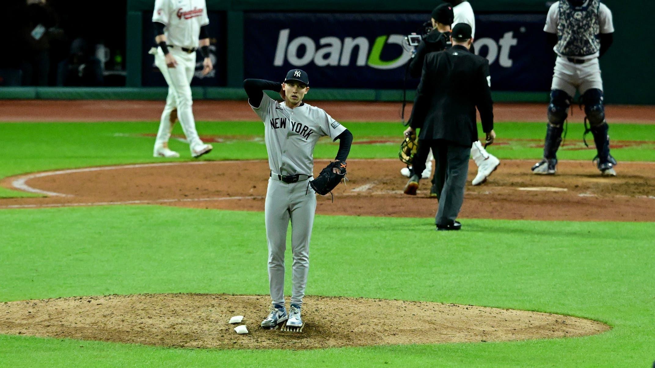 Oct 17, 2024; Cleveland, Ohio, USA; New York Yankees pitcher Luke Weaver (30) reacts after giving up a two-run home run during the ninth inning against the Cleveland Guardians in game 3 of the American League Championship Series at Progressive Field. / David Dermer-Imagn Images