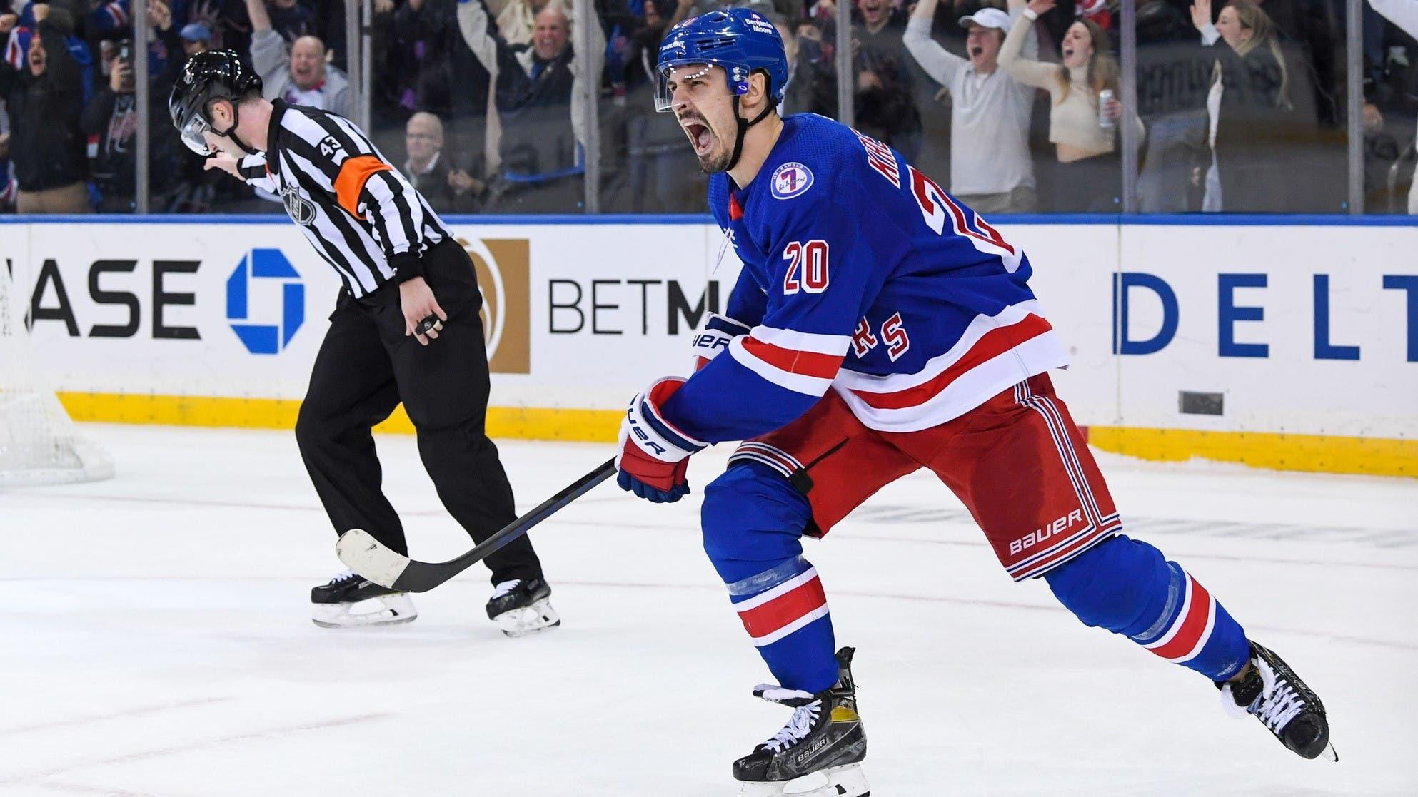 Nov 14, 2021; New York, New York, USA; New York Rangers left wing Chris Kreider (20) celebrates after scoring the winning goal against the New Jersey Devils during shoot outs at Madison Square Garden / Dennis Schneidler-USA TODAY Sports