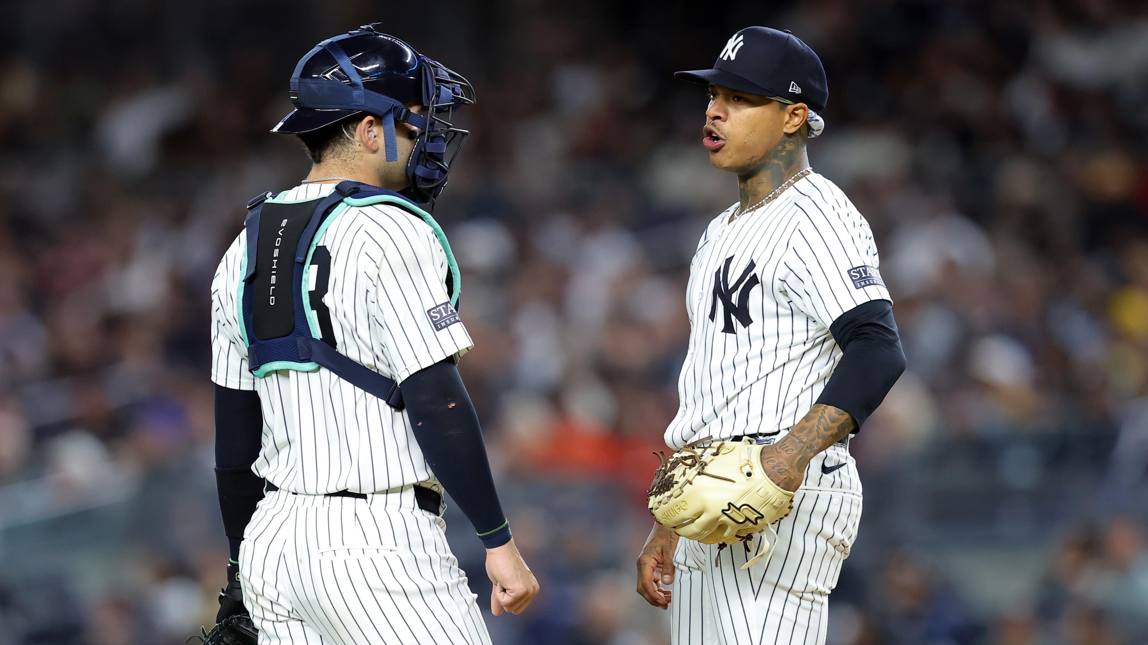 Sep 25, 2024; Bronx, New York, USA; New York Yankees catcher Austin Wells (28) talks to starting pitcher Marcus Stroman (0) during the first inning against the Baltimore Orioles at Yankee Stadium. Mandatory Credit: Brad Penner-Imagn Images