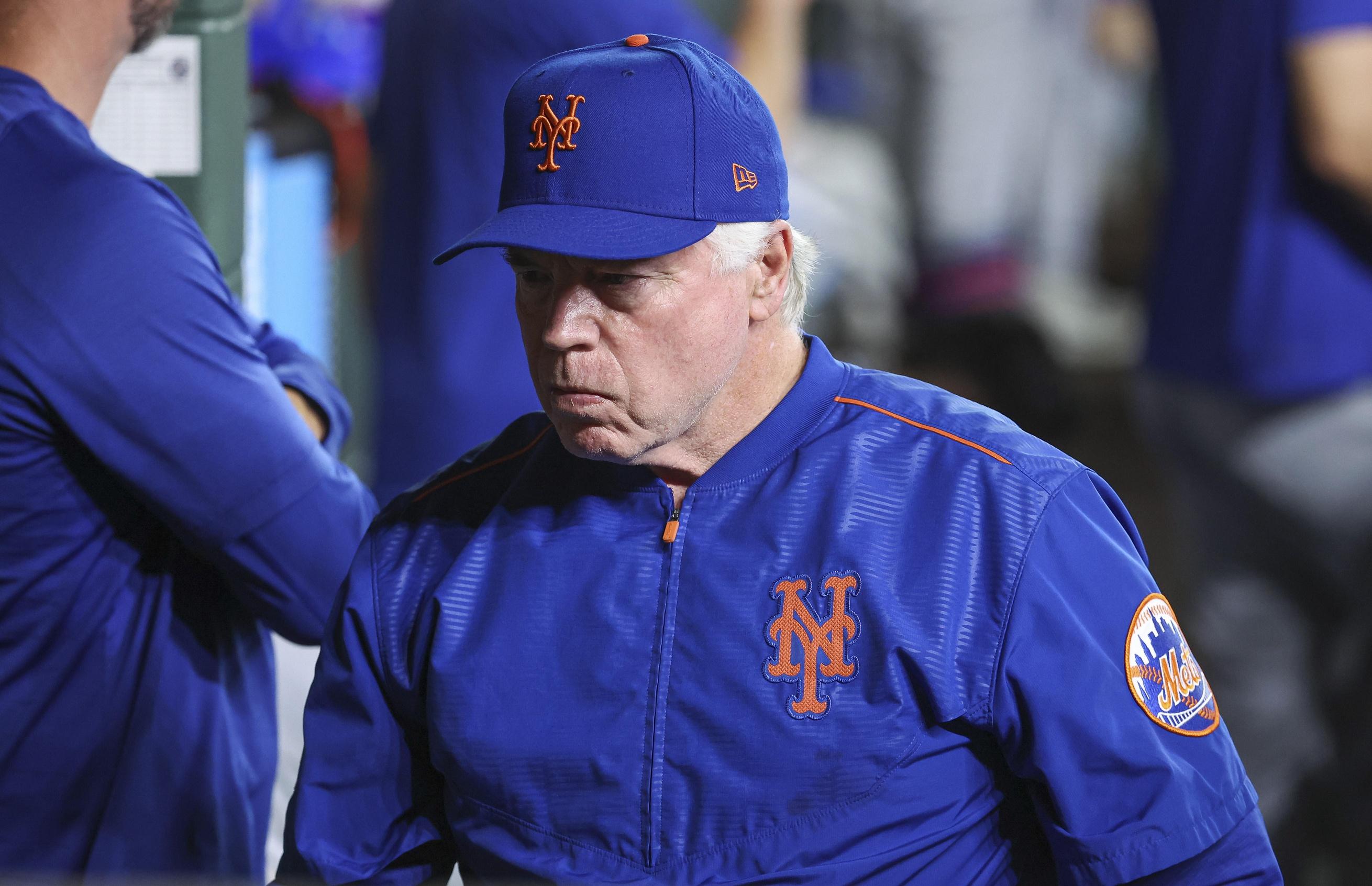 New York Mets manager Buck Showalter (11) walks in the dugout during the game against the Houston Astros at Minute Maid Park.