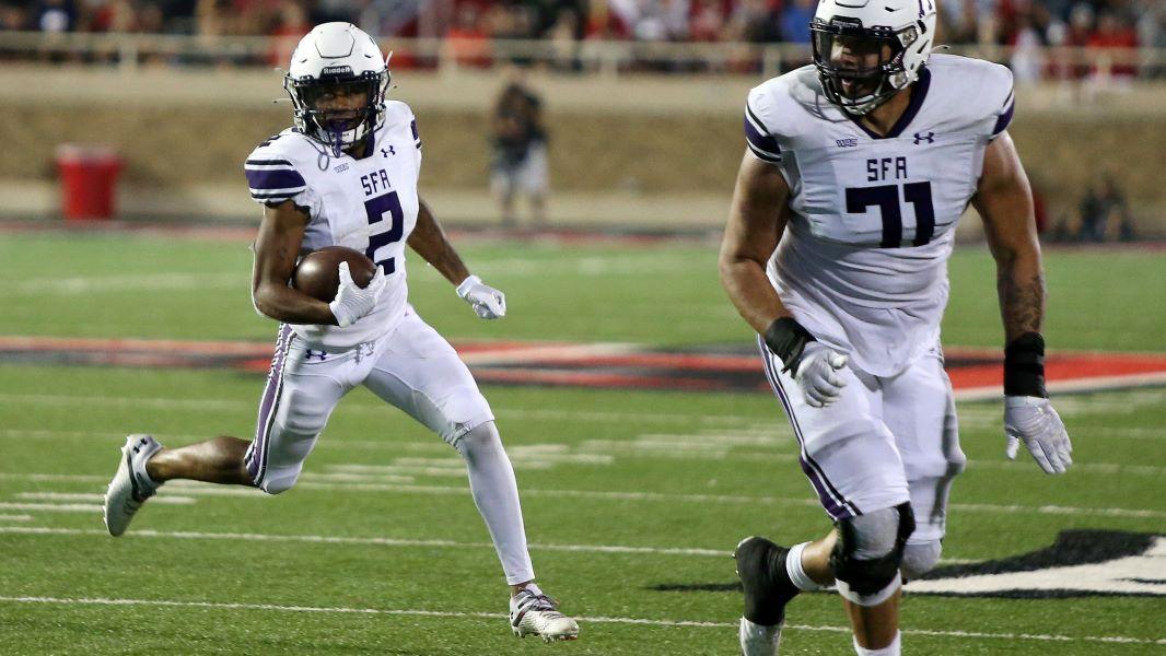 Sep 11, 2021; Lubbock, Texas, USA; Stephen F. Austin Lumberjacks running back Xavier Gipson (2) waits on tight end Keshon Williams (87) and offensive tackle Zach Ingram (71) to block against the Texas Tech Red Raiders in the second half at Jones AT&T Stadium.