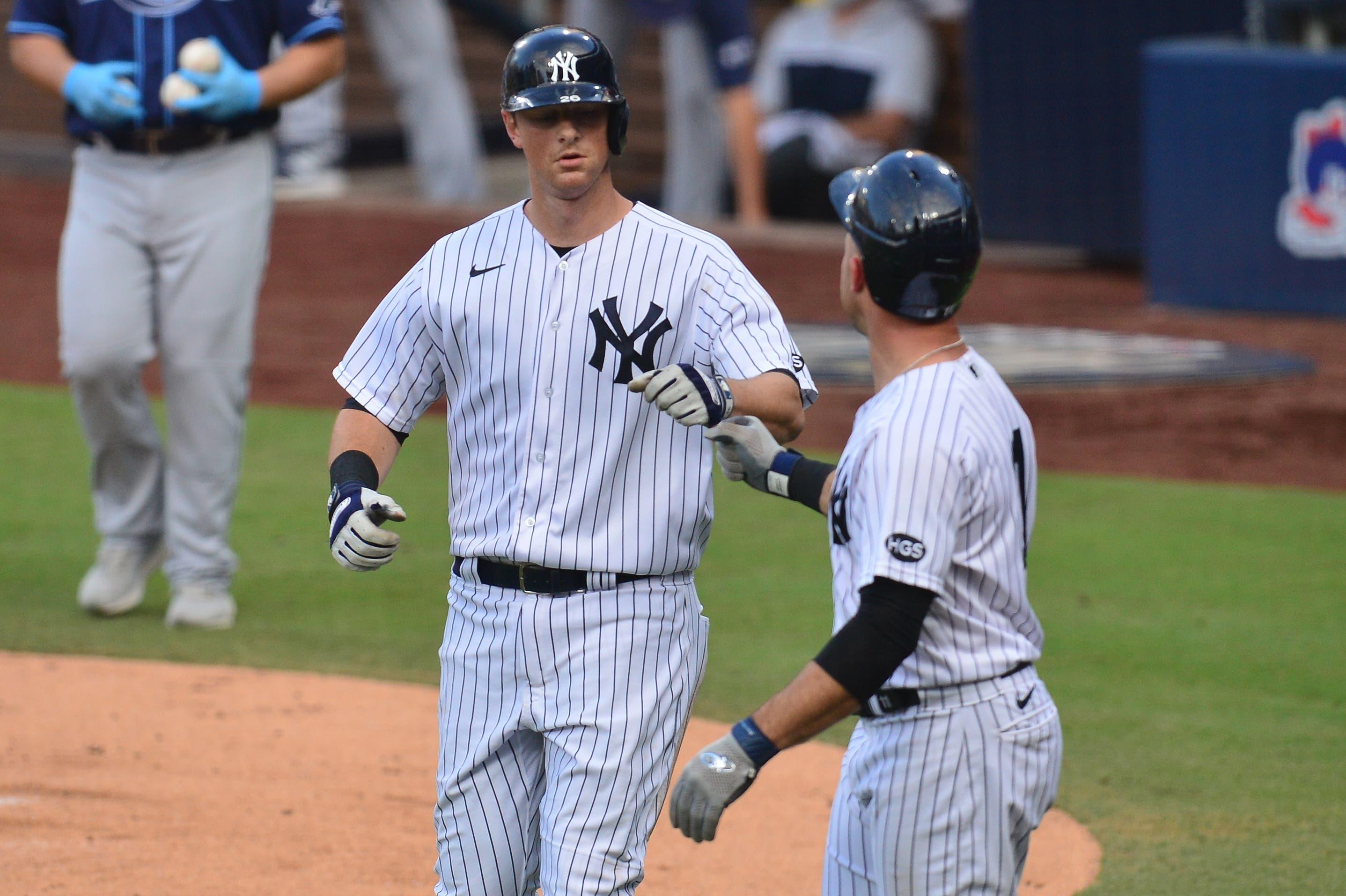 Oct 8, 2020; San Diego, California, USA; New York Yankees second baseman DJ LeMahieu (left) celebrates with left fielder Brett Gardner (right) after driving in in Gardner with a sacrifice fly ball against the Tampa Bay Rays during the second inning of game four of the 2020 ALDS at Petco Park. Mandatory Credit: Gary A. Vasquez-USA TODAY Sports / © Gary A. Vasquez-USA TODAY Sports