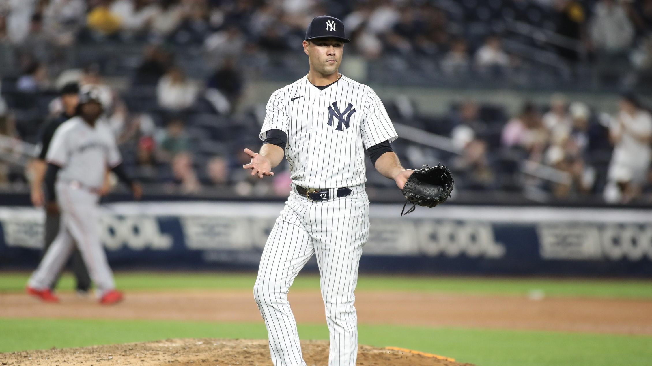 Apr 13, 2023; Bronx, New York, USA; New York Yankees shortstop Isiah Kiner-Falefa (12) looks to see if he will checked for illegal substances after pitching in the ninth inning against the Minnesota Twins at Yankee Stadium.