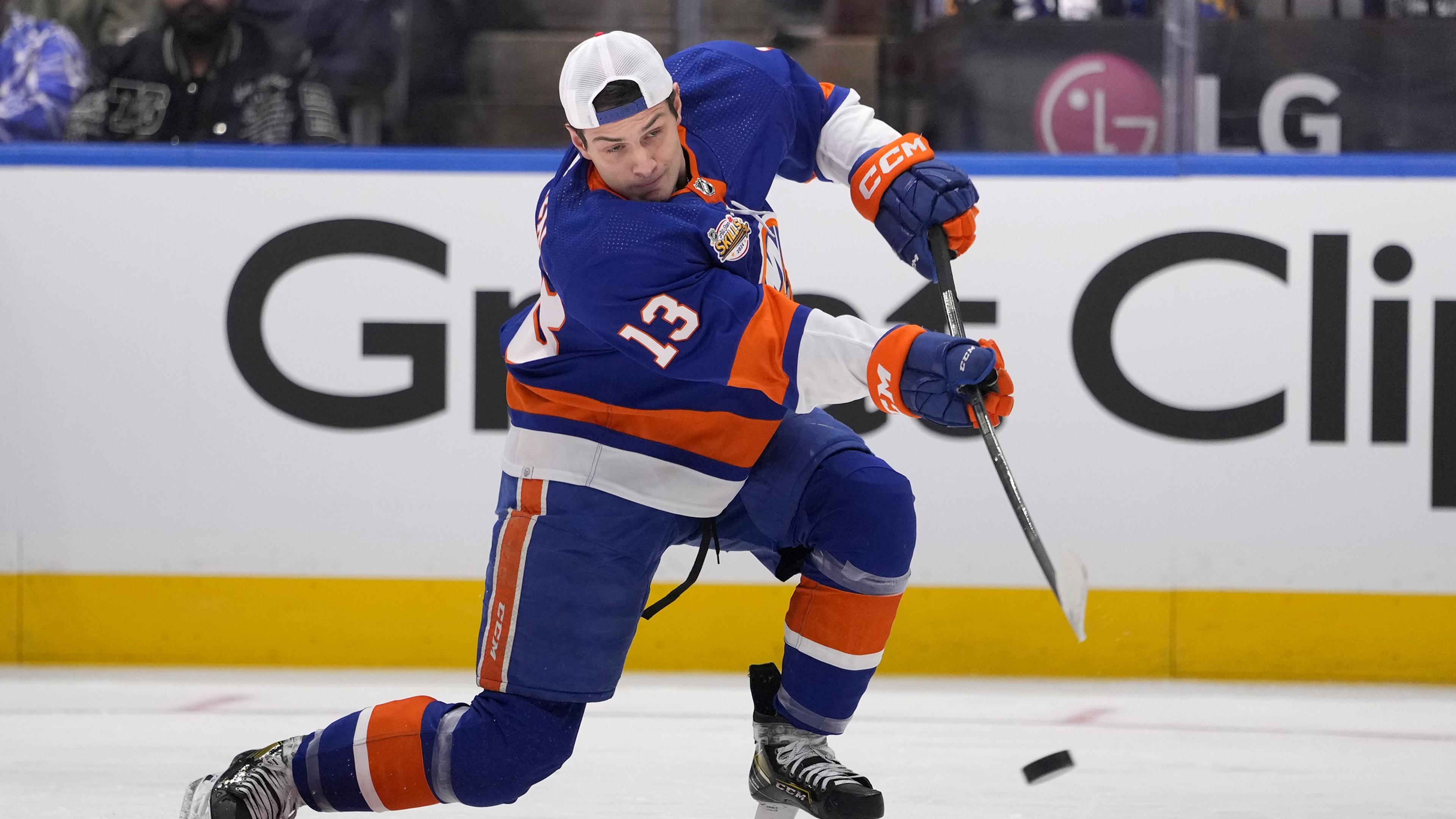 Feb 2, 2024; Toronto, Ontario, CANADA; New York Islanders center Mathew Barzal (13) shoots during the one-timer competition during the NHL All-Star Skills Competition at Scotiabank Arena. Mandatory Credit: John E. Sokolowski-USA TODAY Sports