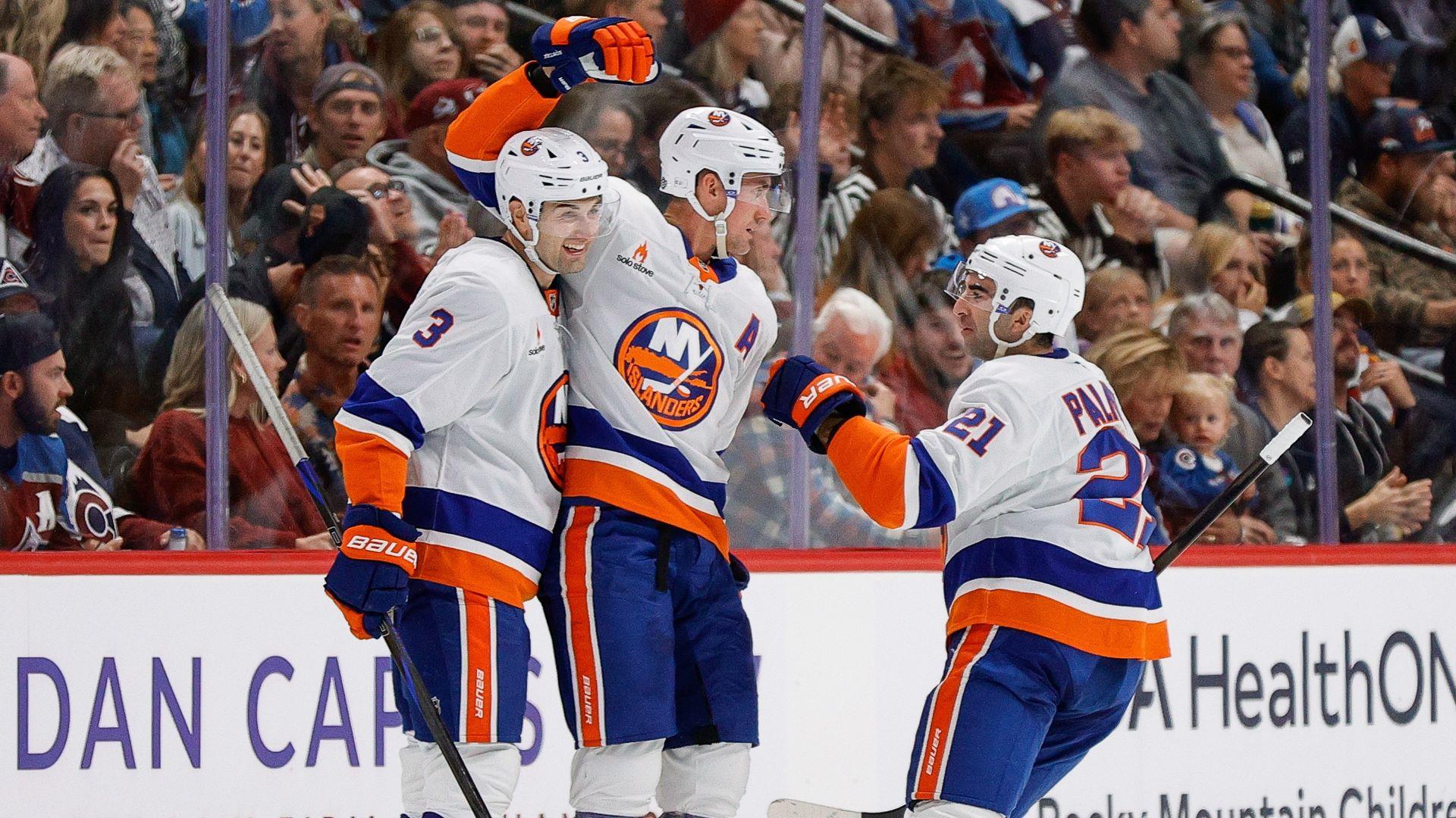 Oct 14, 2024; Denver, Colorado, USA; New York Islanders center Brock Nelson (29) celebrates his goal with defenseman Adam Pelech (3) and center Kyle Palmieri (21) in the second period against the Colorado Avalanche at Ball Arena. 