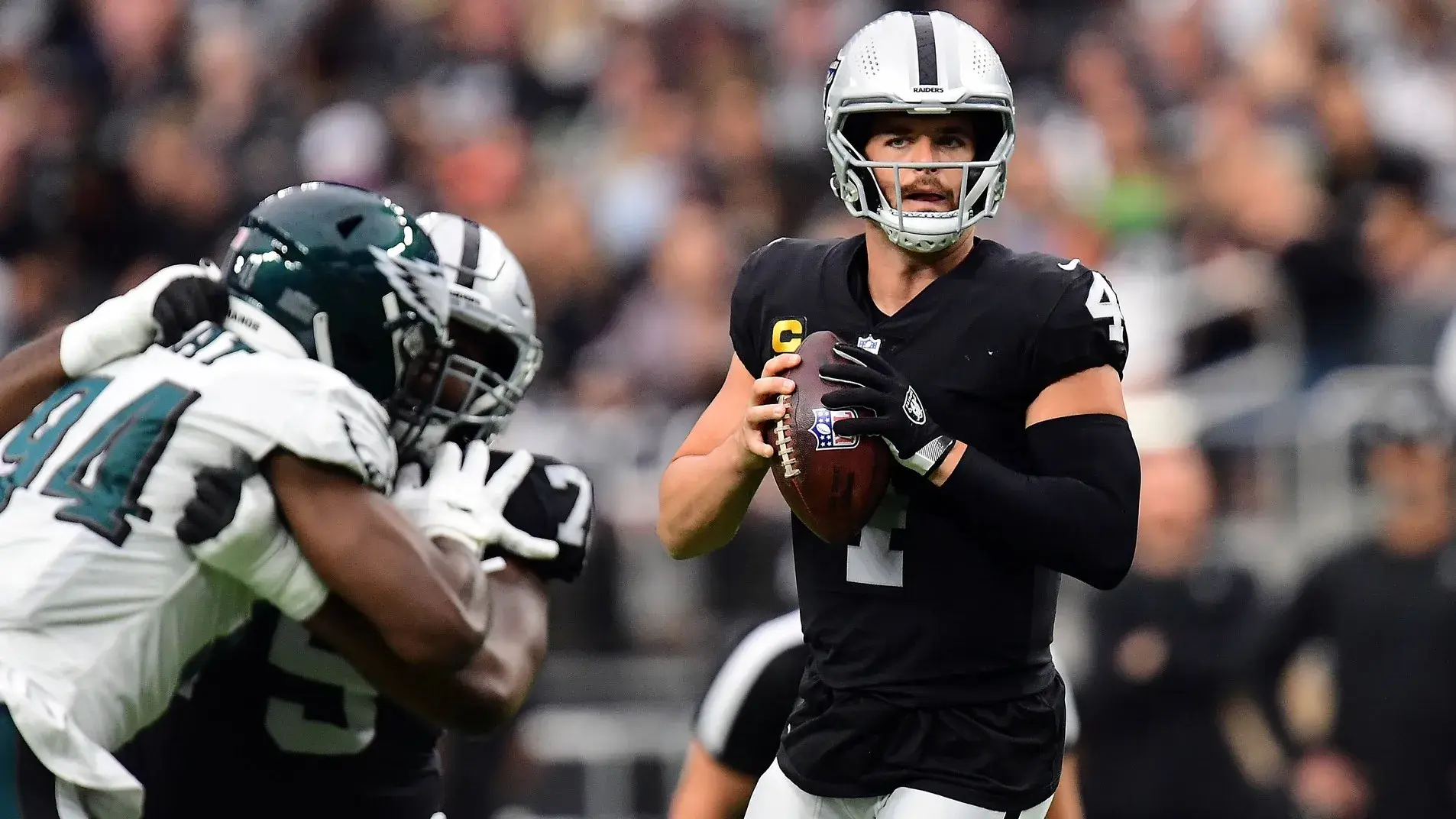 Oct 24, 2021; Paradise, Nevada, USA; Las Vegas Raiders quarterback Derek Carr (4) drops back to pass against the Philadelphia Eagles during the first half at Allegiant Stadium. / Gary A. Vasquez-USA TODAY Sports