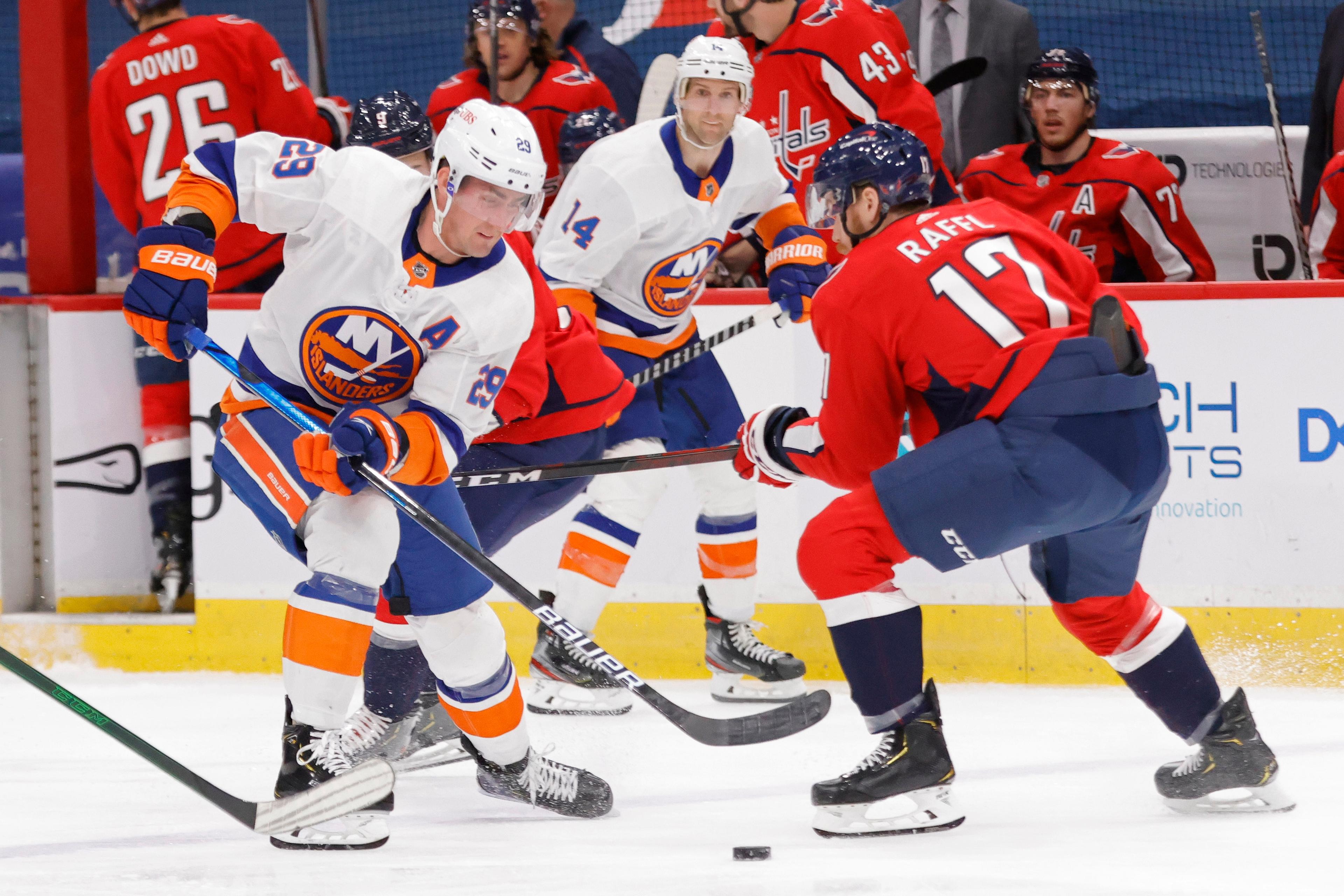 Apr 27, 2021; Washington, District of Columbia, USA; New York Islanders center Brock Nelson (29) skates with the puck as Washington Capitals left wing Michael Raffl (17) defends in the first period at Capital One Arena. Mandatory Credit: Geoff Burke-USA TODAY Sports