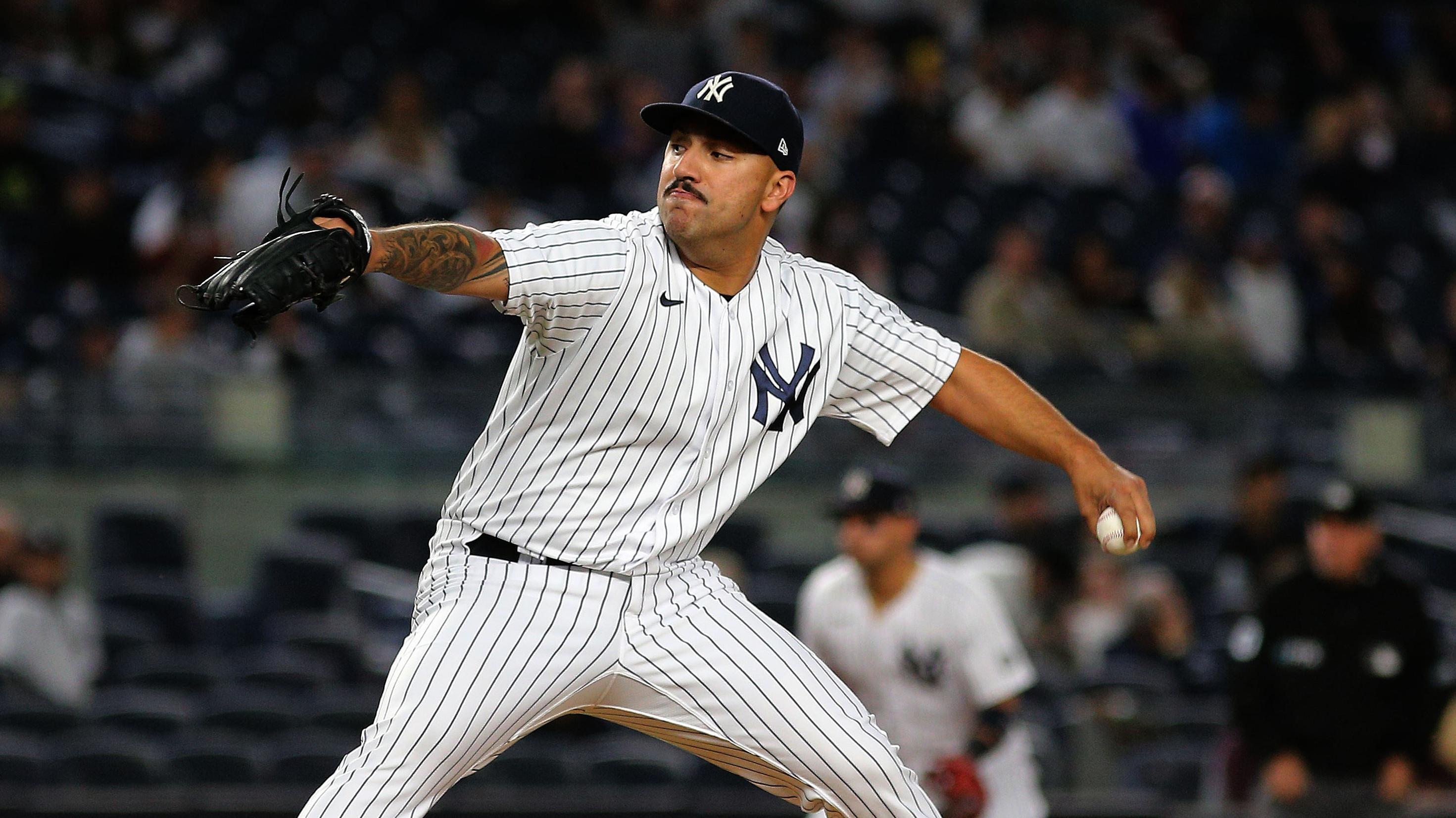 Oct 1, 2021; Bronx, New York, USA; New York Yankees starting pitcher Nestor Cortes (65) pitches against the Tampa Bay Rays during the first inning at Yankee Stadium. Mandatory Credit: Andy Marlin-USA TODAY Sports