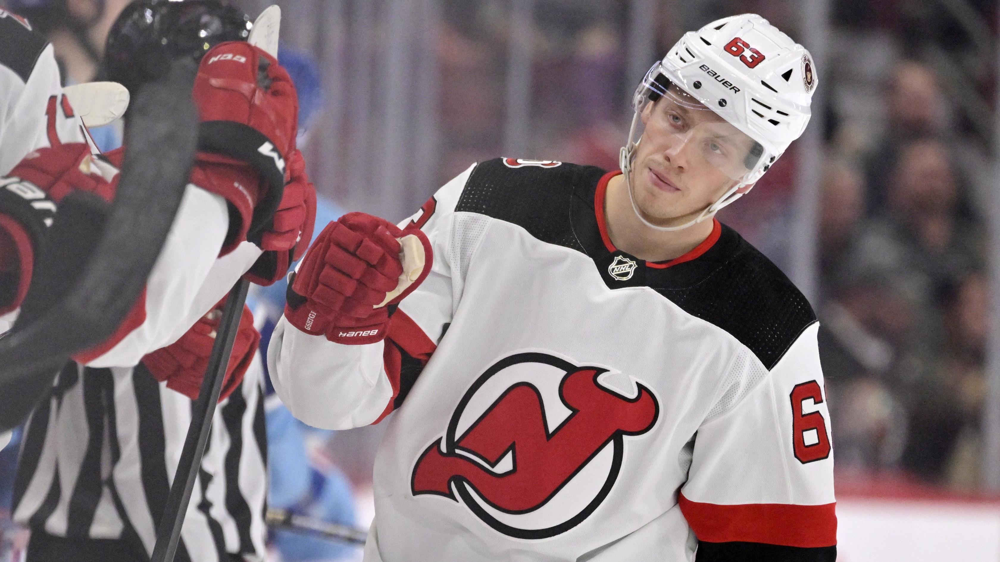 New Jersey Devils forward Jesper Bratt (63) celebrates with teammates after scoring a goal against the Montreal Canadiens during the third period at the Bell Centre