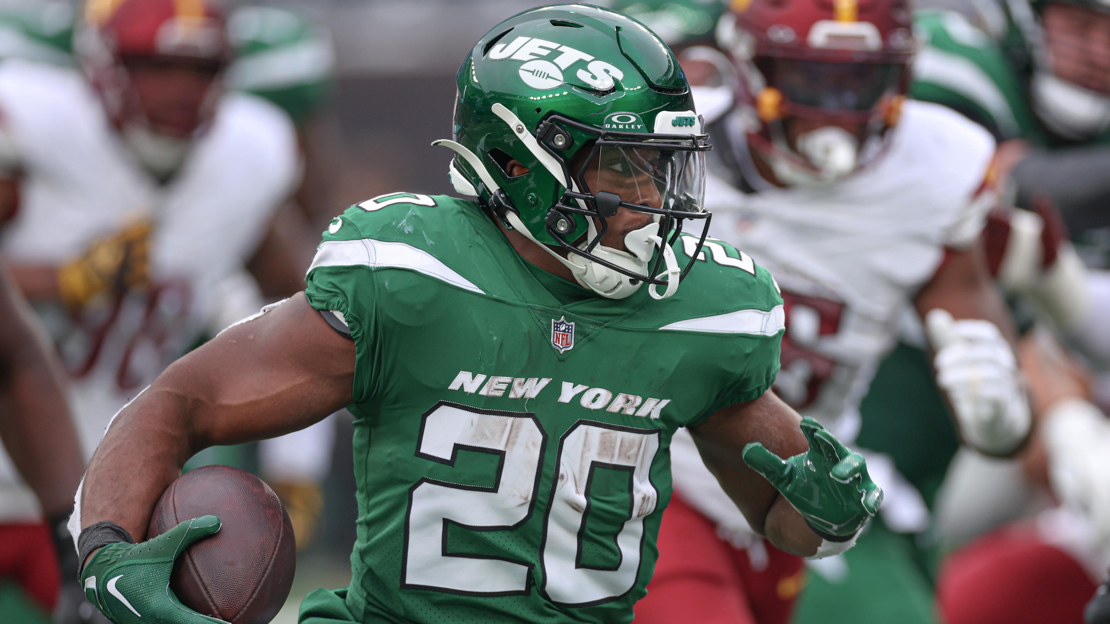 Dec 24, 2023; East Rutherford, New Jersey, USA; New York Jets running back Breece Hall (20) carries the ball during the first half against the Washington Commanders at MetLife Stadium. Mandatory Credit: Vincent Carchietta-USA TODAY Sports