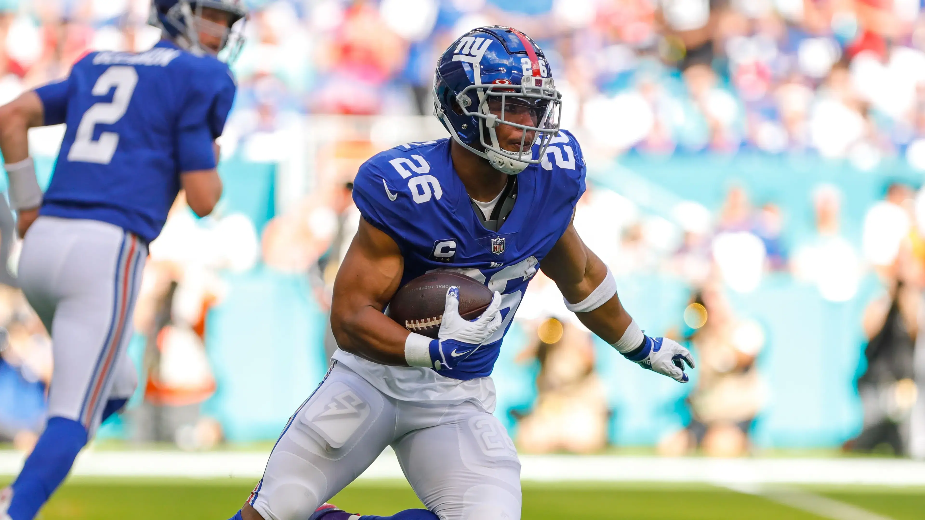 New York Giants running back Saquon Barkley (26) runs with the football against the Miami Dolphins during the first half at Hard Rock Stadium. / Sam Navarro-USA TODAY Sports