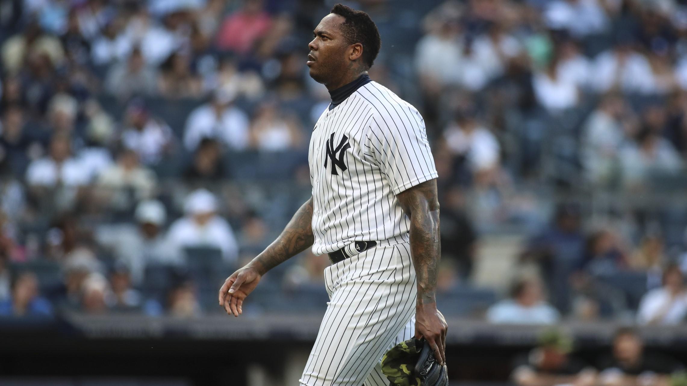 May 22, 2022; Bronx, New York, USA; New York Yankees relief pitcher Aroldis Chapman (54) walks off the mound in the ninth inning after blowing a save against the Chicago White Sox at Yankee Stadium.