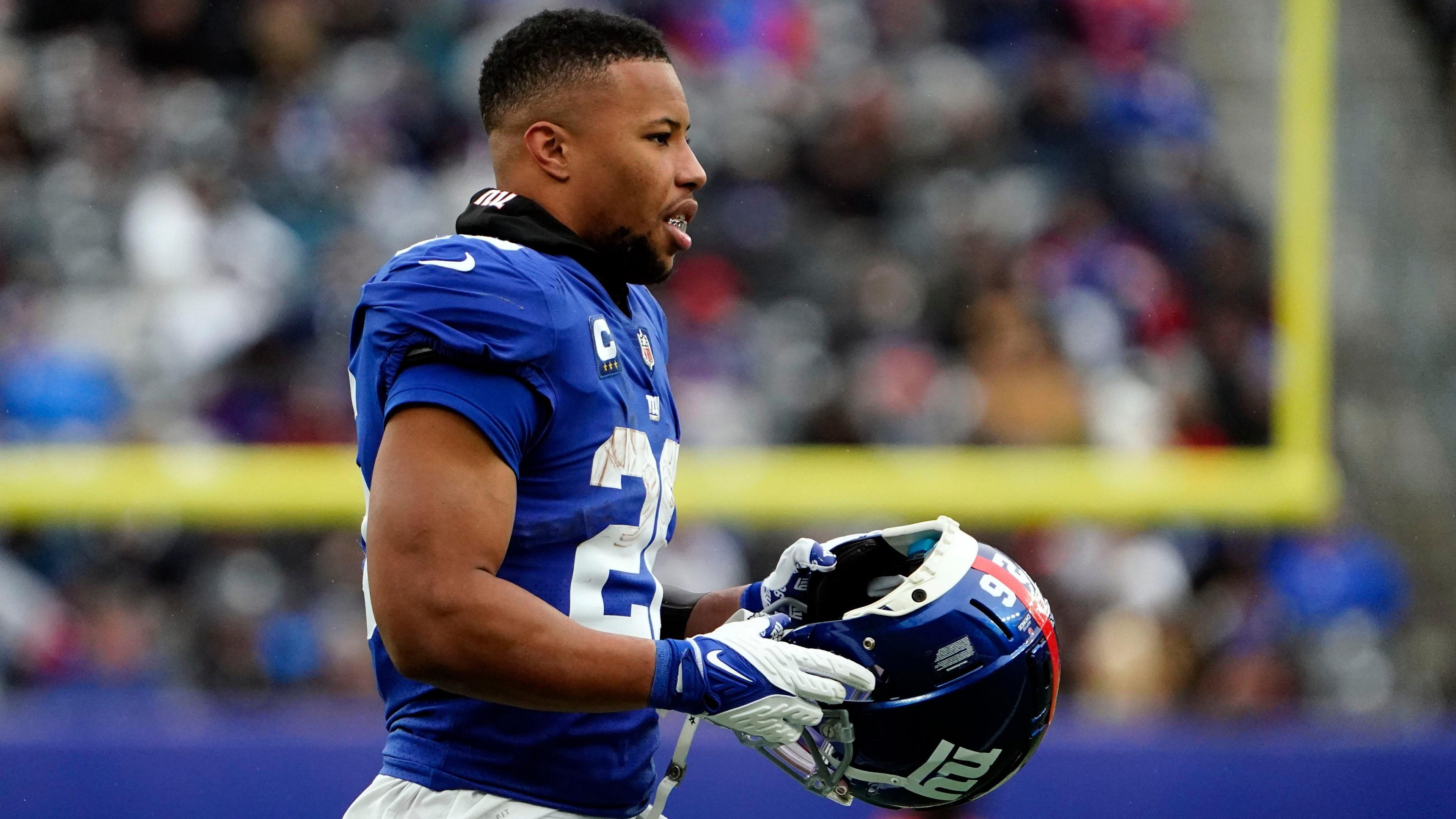 New York Giants running back Saquon Barkley (26) walks onto the field in the second half. The Giants lose to Washington, 22-7, at MetLife Stadium on Sunday, Jan. 9, 2022. / Danielle Parhizkaran/NorthJersey.com-Imagn Content Services, LLC