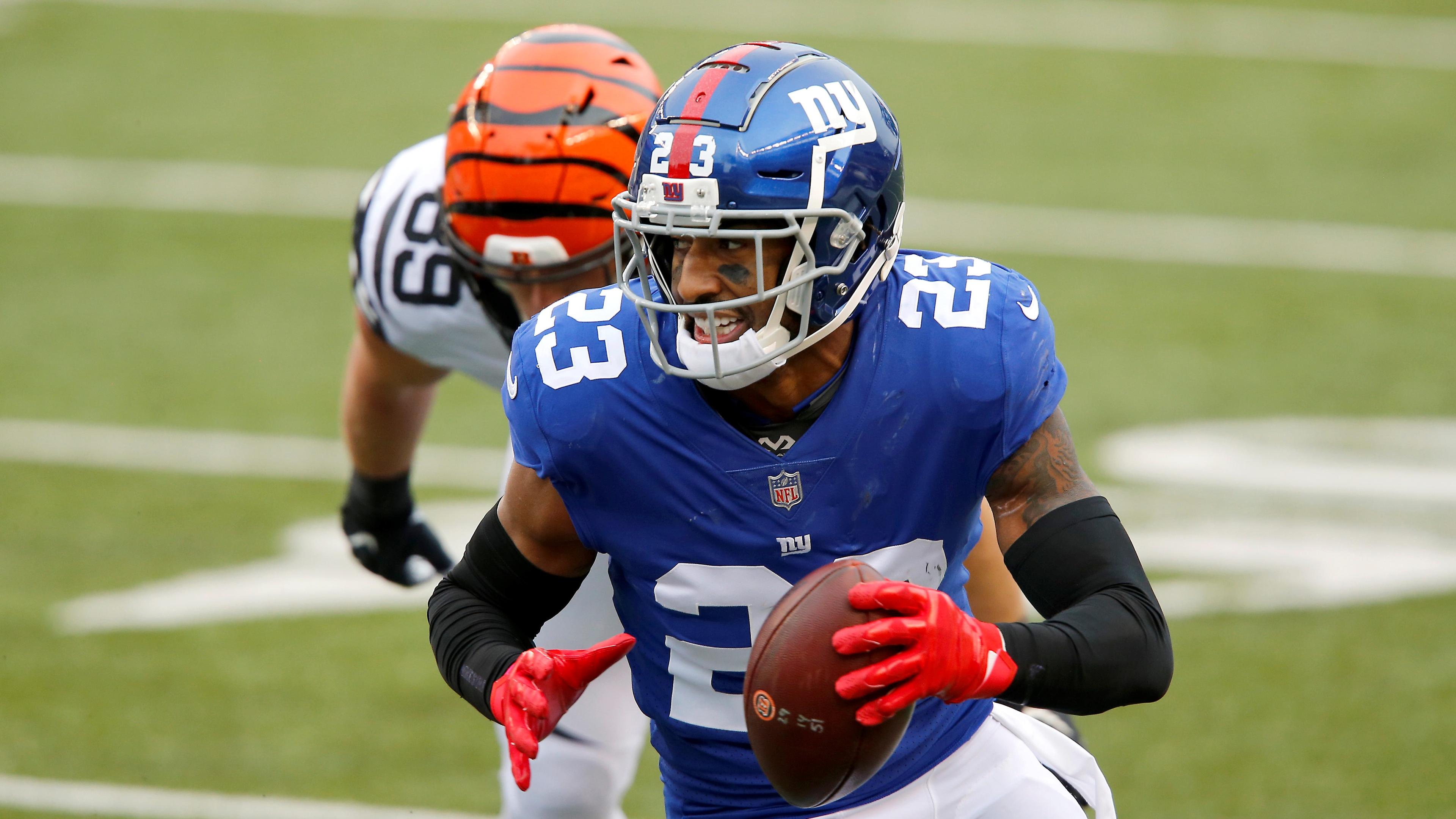 Nov 29, 2020; Cincinnati, Ohio, USA; New York Giants free safety Logan Ryan (23) runs with the ball after recovering the forced fumble during the fourth quarter against the Cincinnati Bengals at Paul Brown Stadium. Mandatory Credit: Joseph Maiorana-USA TODAY Sports