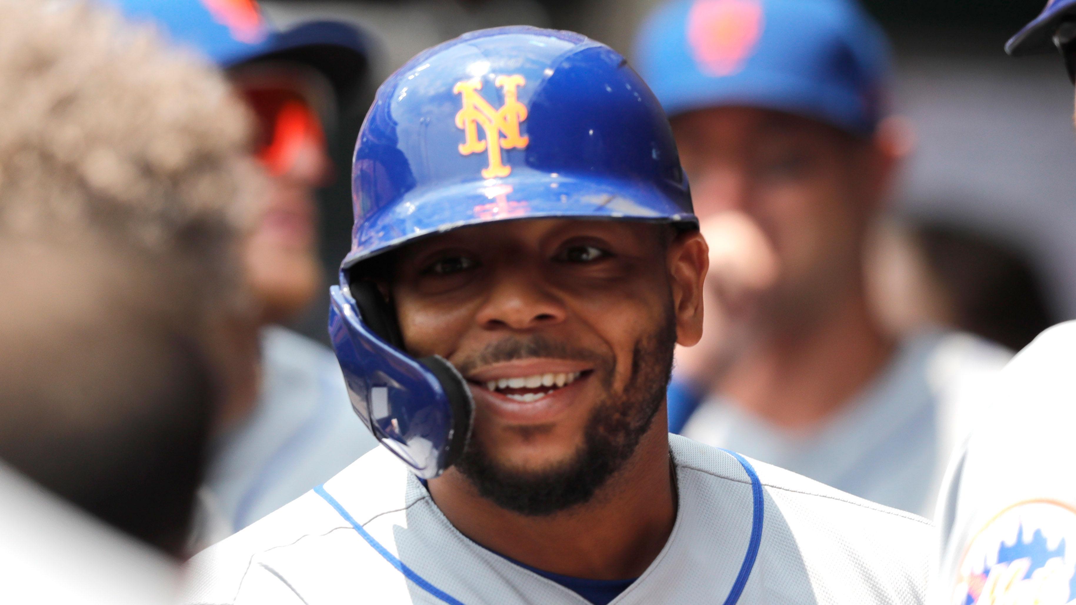 Jul 21, 2021; Cincinnati, Ohio, USA; New York Mets left fielder Dominic Smith (2) celebrates in the dugout after hitting a grand slam home run against the Cincinnati Reds in the third inning at Great American Ball Park.