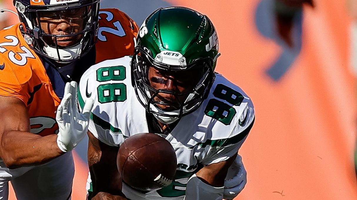 Sep 26, 2021; Denver, Colorado, USA; New York Jets wide receiver Keelan Cole (88) makes a catch as Denver Broncos cornerback Kyle Fuller (23) defends in the third quarter at Empower Field at Mile High. Mandatory Credit: Isaiah J. Downing-USA TODAY Sports