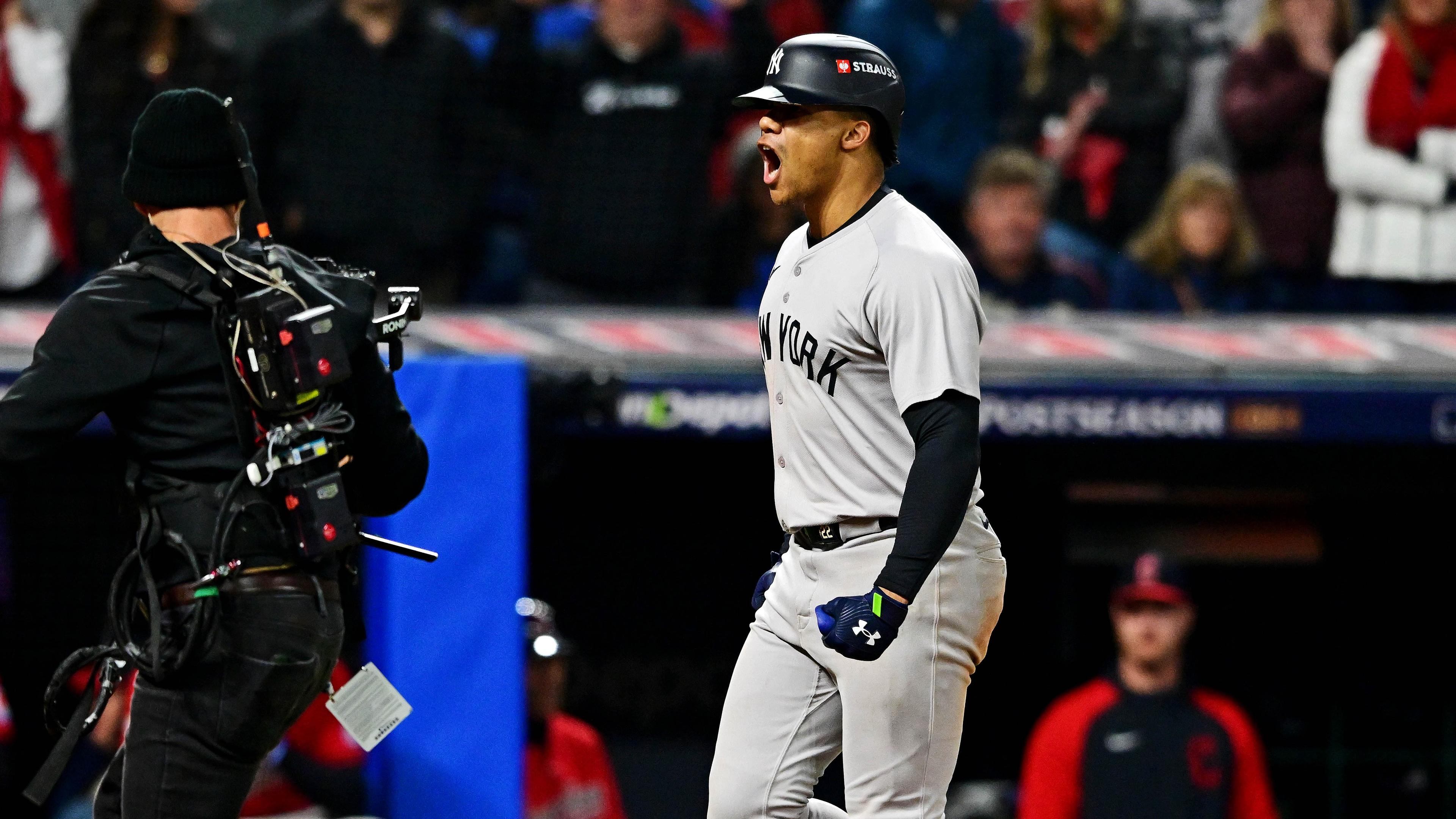 New York Yankees outfielder Juan Soto (22) crosses home plate after hitting a three run home run during the tenth inning against the Cleveland Guardians during game five of the ALCS for the 2024 MLB playoffs at Progressive Field