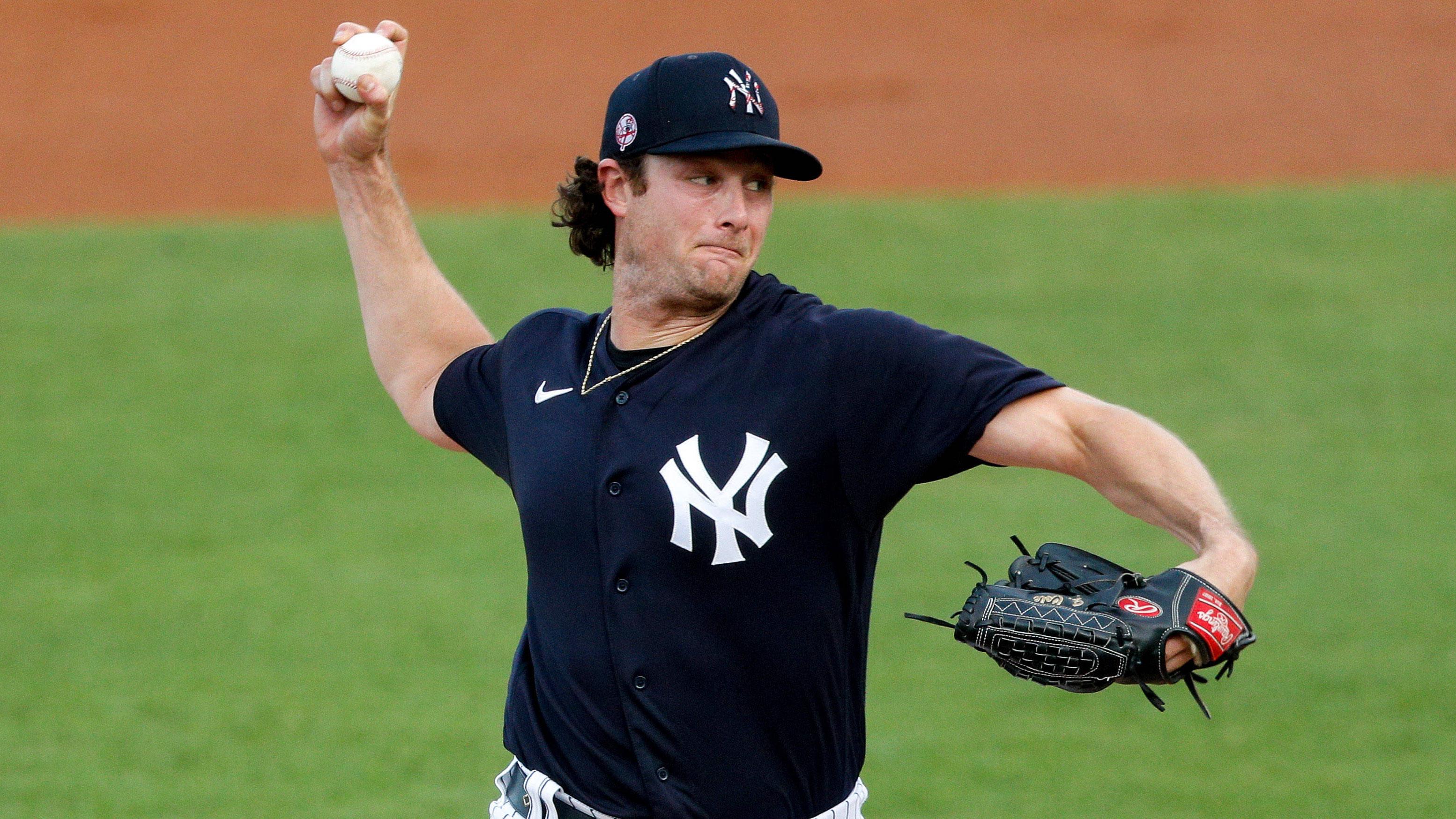 Mar 26, 2021; Tampa, Florida, USA; New York Yankees starting pitcher Gerrit Cole (45) pitches in the first inning against the Baltimore Orioles during spring training at George M. Steinbrenner Field.