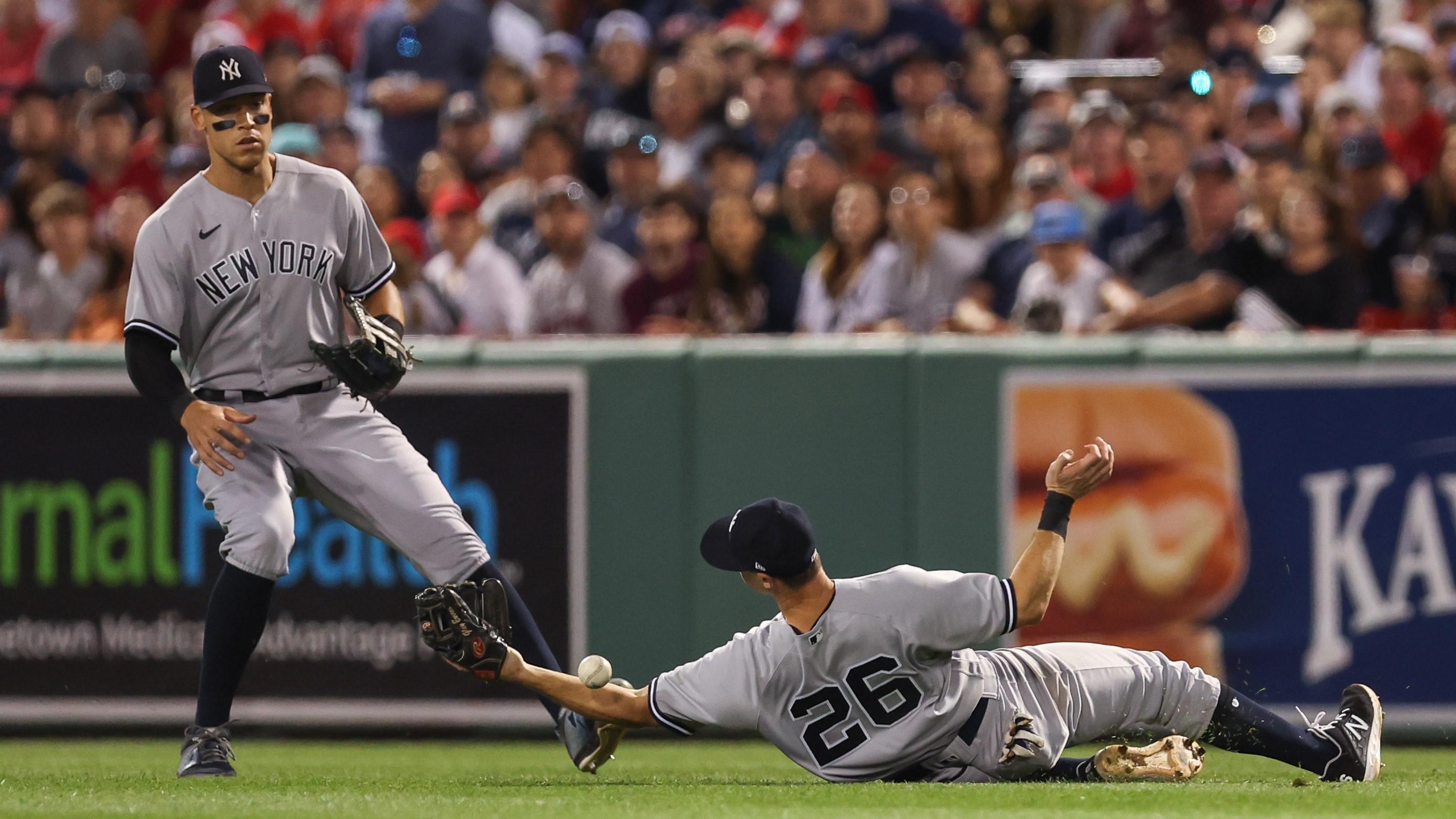 Jul 10, 2022; Boston, Massachusetts, USA; New York Yankees second baseman DJ LeMahieu (26) drops a fly ball during the sixth inning against the Boston Red Sox at Fenway Park. Mandatory Credit: Paul Rutherford-USA TODAY Sports