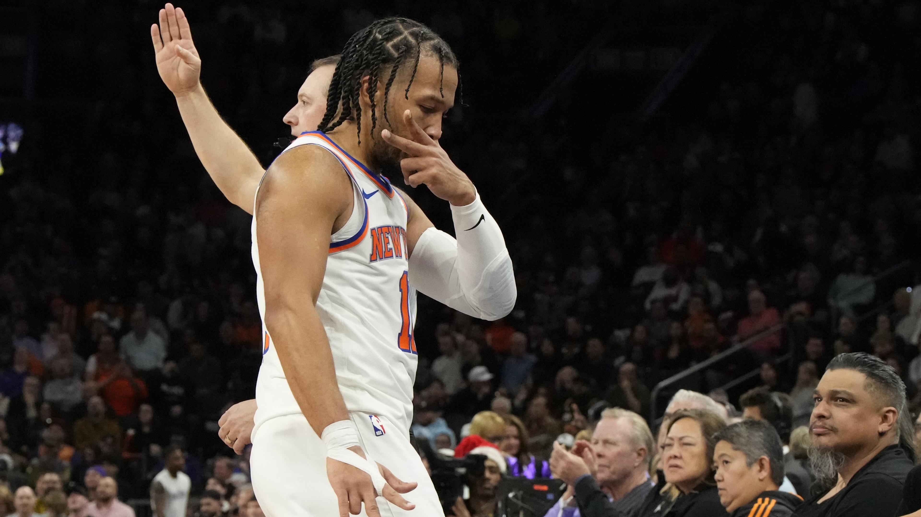 New York Knicks guard Jalen Brunson (11) reacts after scoring against the Phoenix Suns in the second half at Footprint Center