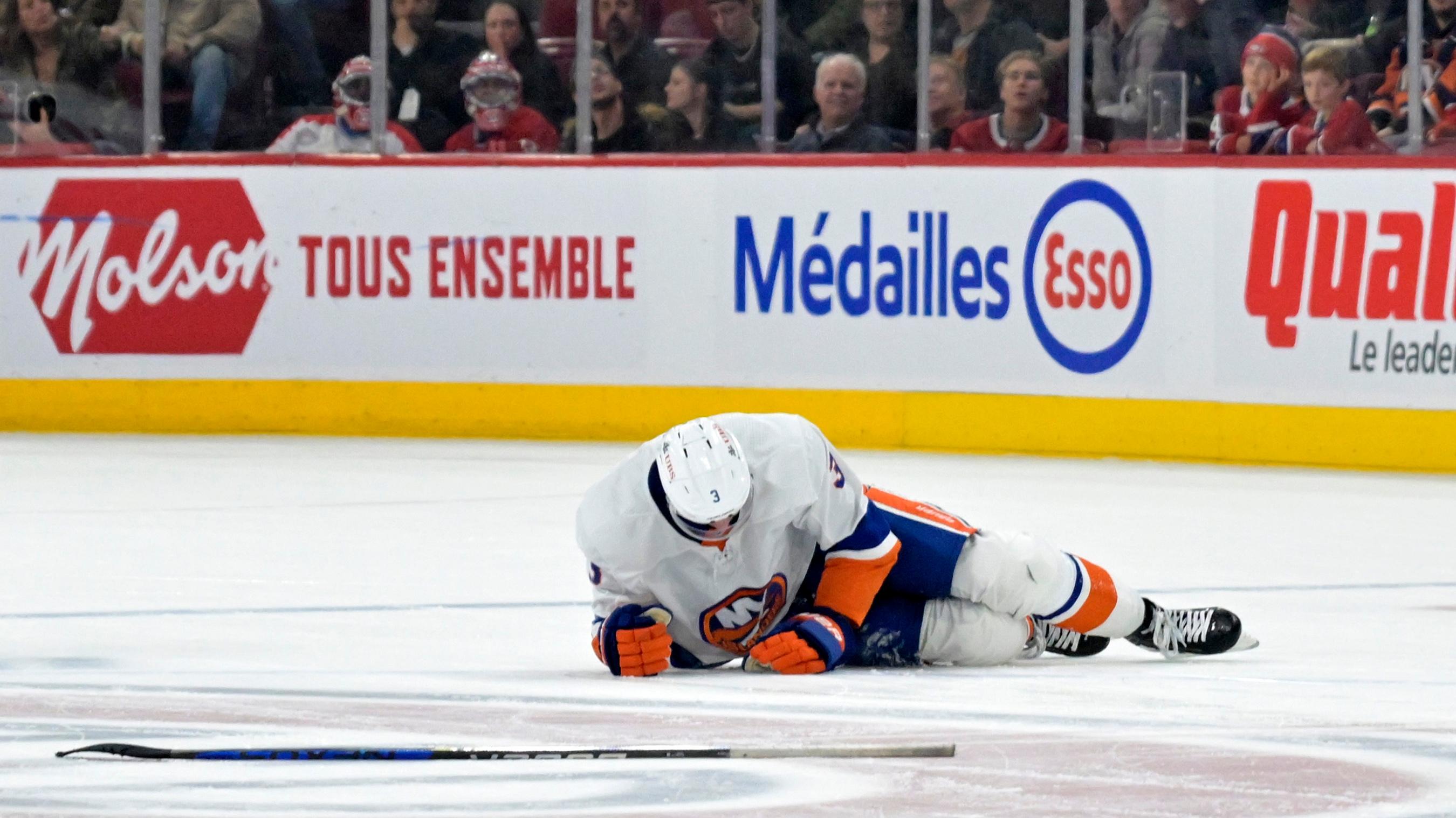 New York Islanders defenseman Adam Pelech (3) lays on the ice after an apparent injury during the third period of the game against the Montreal Canadiens at the Bell Centre.