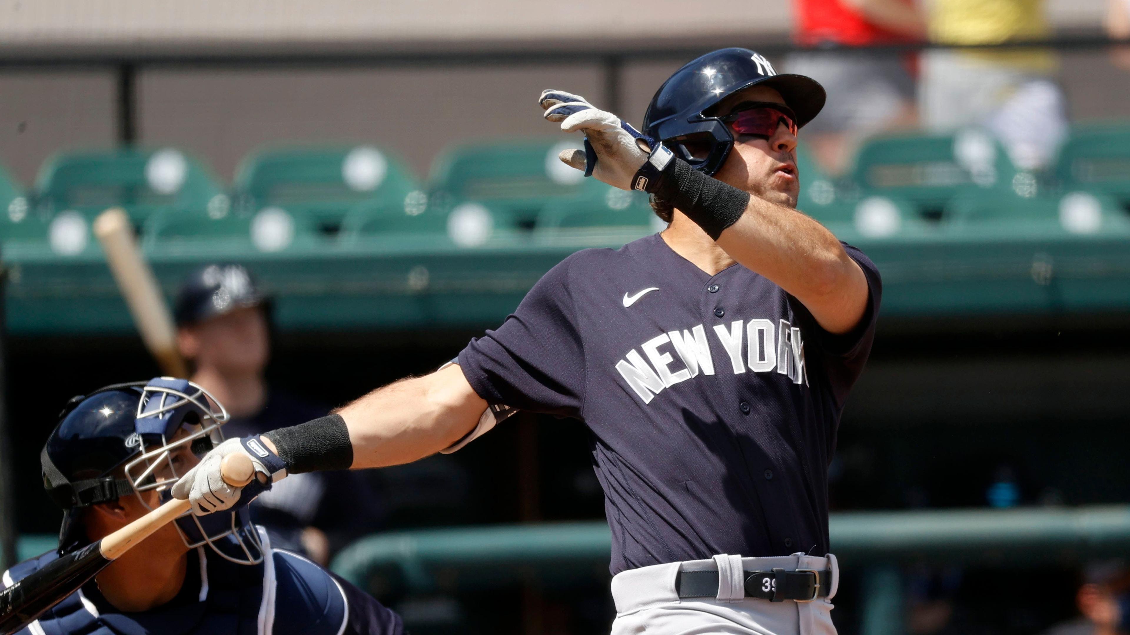 New York Yankees center fielder Mike Tauchman (R) hits a home run during the first inning against the Detroit Tigers at Publix Field at Joker Marchant Stadium. / USA TODAY Sports