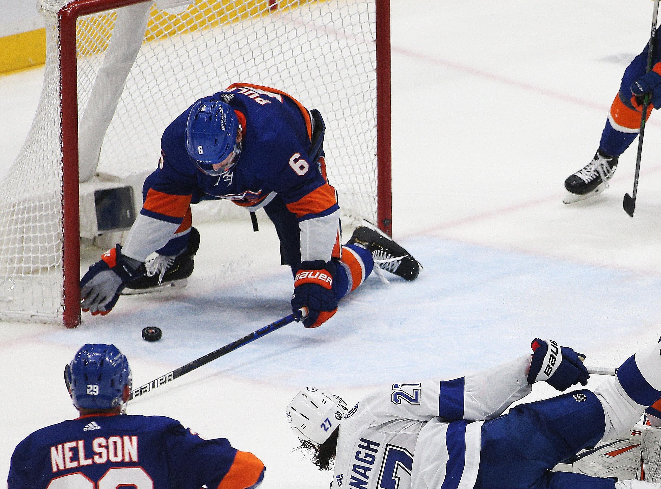 Jun 19, 2021; Uniondale, New York, USA; New York Islanders defenseman Ryan Pulock (6) makes a last second save to secure the victory against the Tampa Bay Lightning during the third period of game four of the 2021 Stanley Cup Semifinals at Nassau Veterans Memorial Coliseum. Mandatory Credit: Andy Marlin-USA TODAY Sports