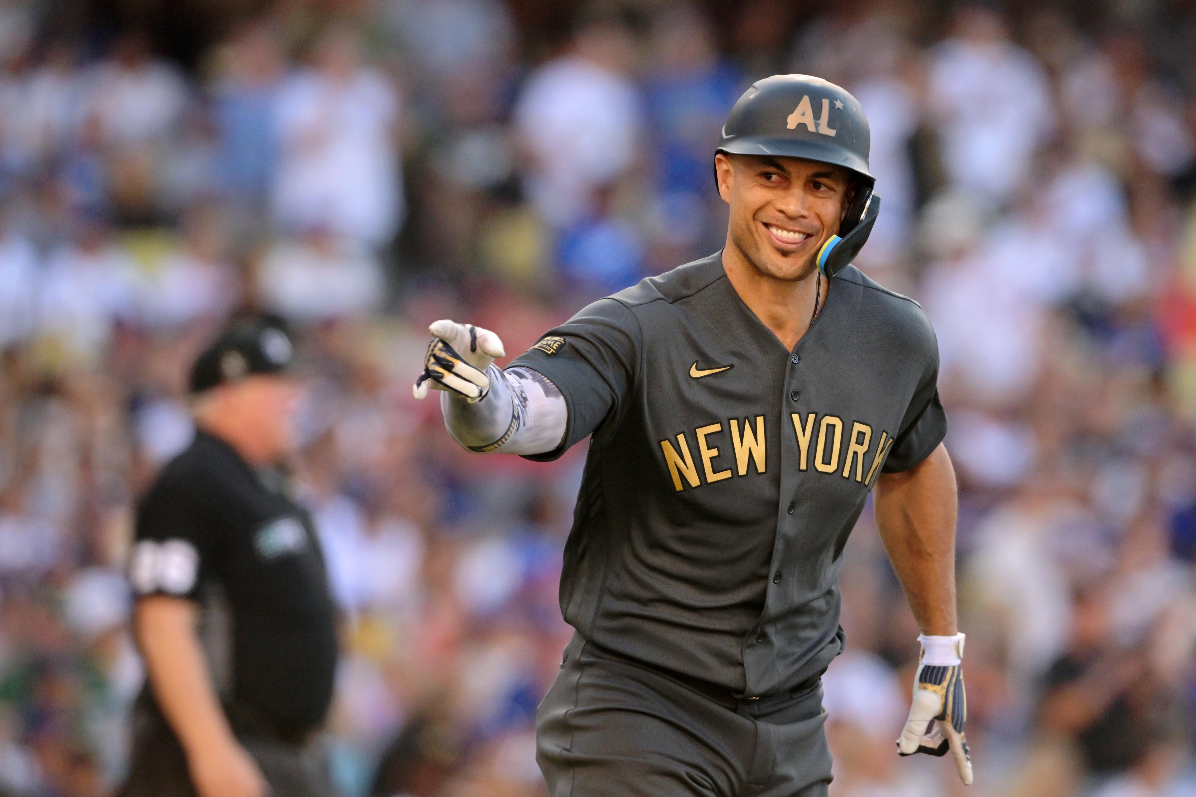 Jul 19, 2022; Los Angeles, California, USA; American League outfielder Giancarlo Stanton (27) of the New York Yankees reacts after hitting a two-run home run against the National League during the fourth inning of the 2022 MLB All Star Game at Dodger Stadium. Mandatory Credit: Jayne Kamin-Oncea-USA TODAY Sports