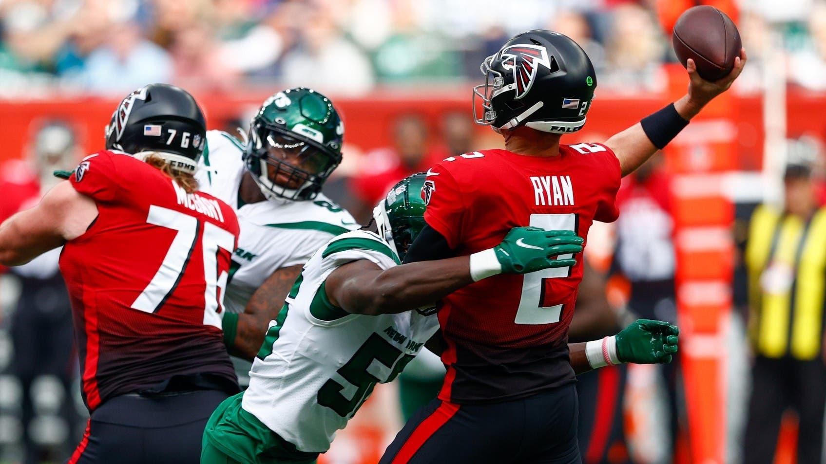 Oct 10, 2021; London, England, United Kingdom; Atlanta Falcons quarterback Matt Ryan (2) is pressured in the first half by New York Jets outside linebacker Quincy Williams (56) at Tottenham Hotspur Stadium. / Nathan Ray Seebeck-USA TODAY Sports