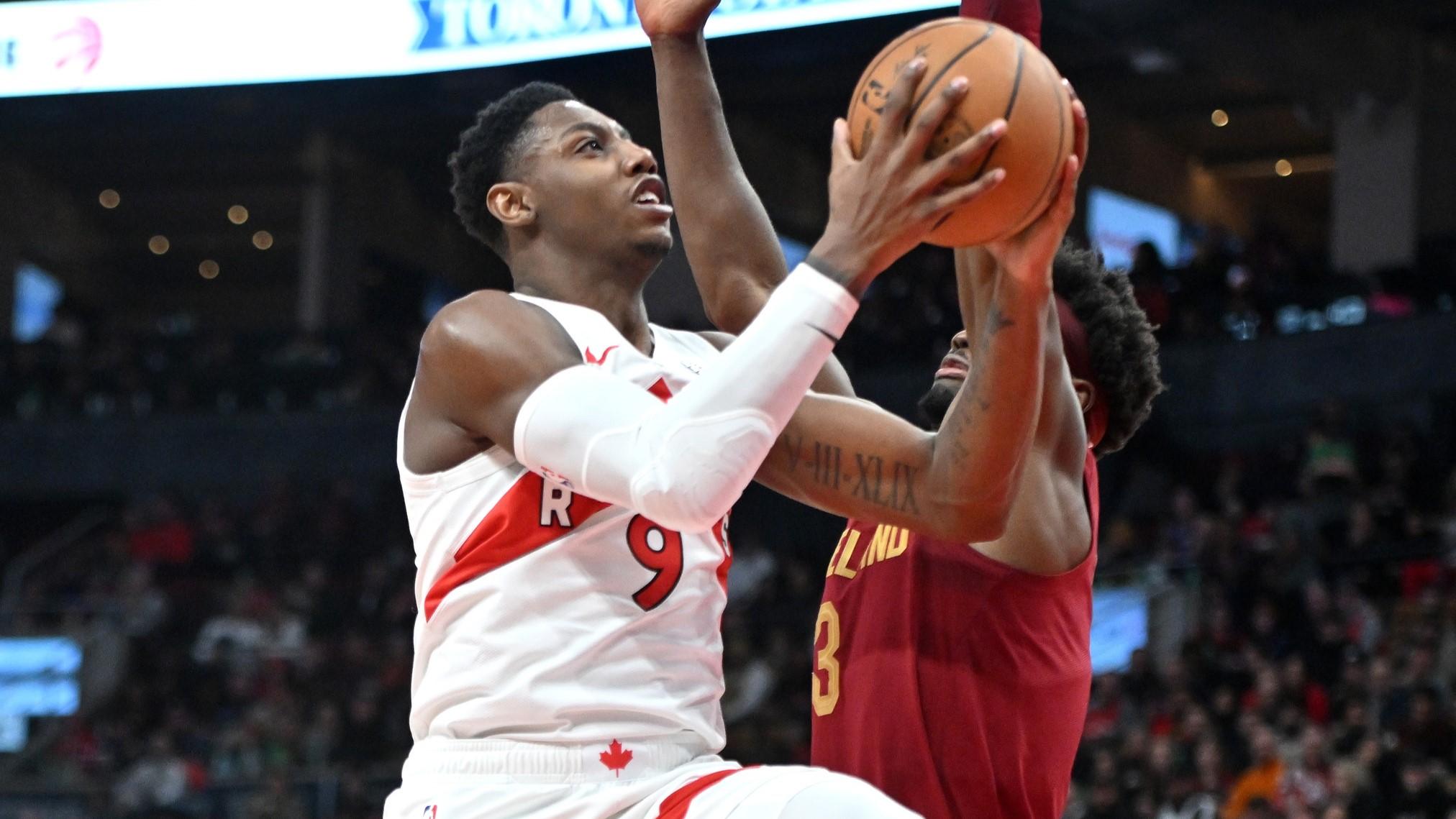 Jan 1, 2024; Toronto, Ontario, CAN; Toronto Raptors forward RJ Barrett (9) drives to the basket past Cleveland Cavaliers guard Caris LaVert (3) in the second half at Scotiabank Arena.