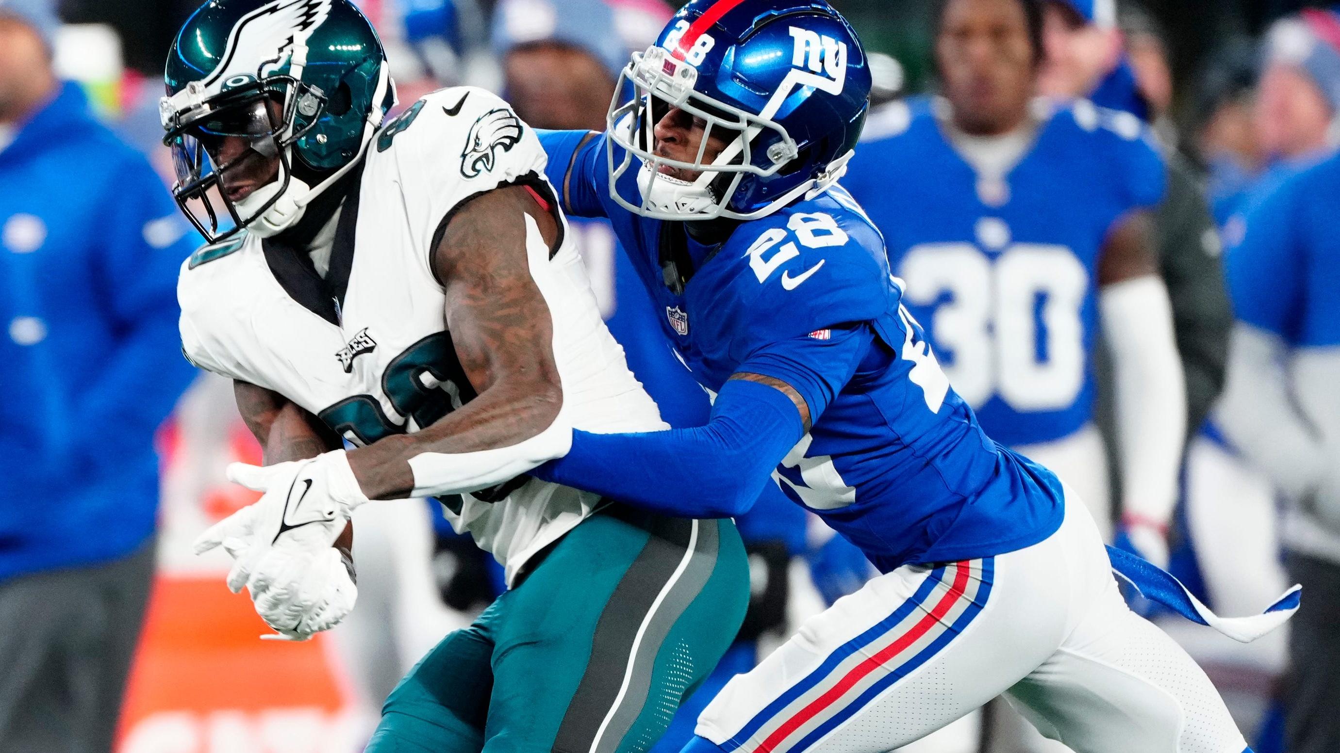 New York Giants cornerback Cor'Dale Flott (28) makes sure Philadelphia Eagles wide receiver Julio Jones (80) does not complete a second quarter pass