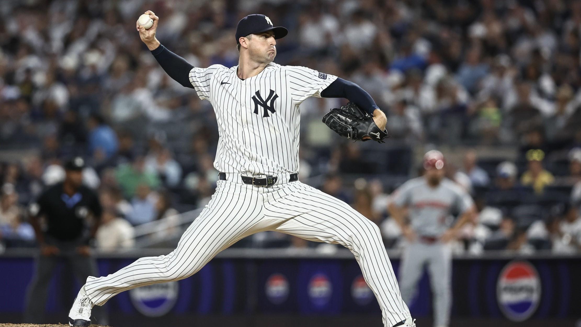 Jul 3, 2024; Bronx, New York, USA; New York Yankees pitcher Clay Holmes (35) pitches in the ninth inning against the Cincinnati Reds at Yankee Stadium. 