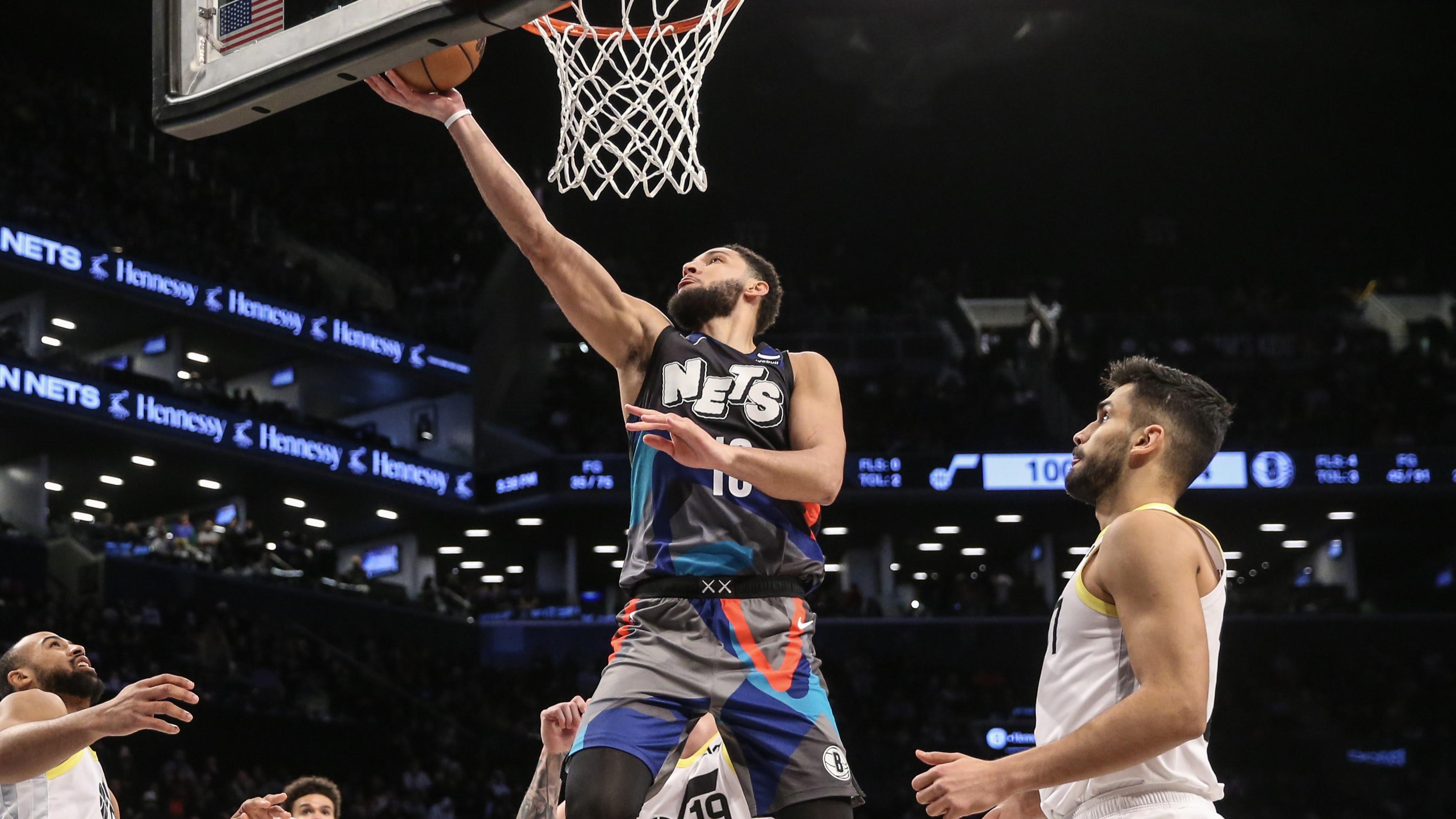 Jan 29, 2024; Brooklyn, New York, USA; Brooklyn Nets guard Ben Simmons (10) drives past Utah Jazz center Omer Yurtseven (77) for a layup in the fourth quarter at Barclays Center. Mandatory Credit: Wendell Cruz-USA TODAY Sports