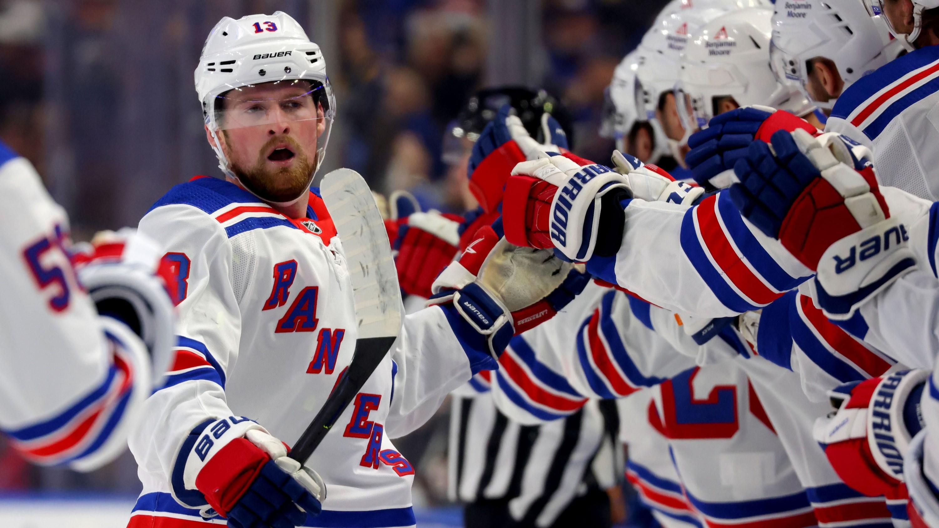 Oct 12, 2023; Buffalo, New York, USA; New York Rangers left wing Alexis Lafreniere (13) celebrates his goal with teammates during the first period against the Buffalo Sabres at KeyBank Center.