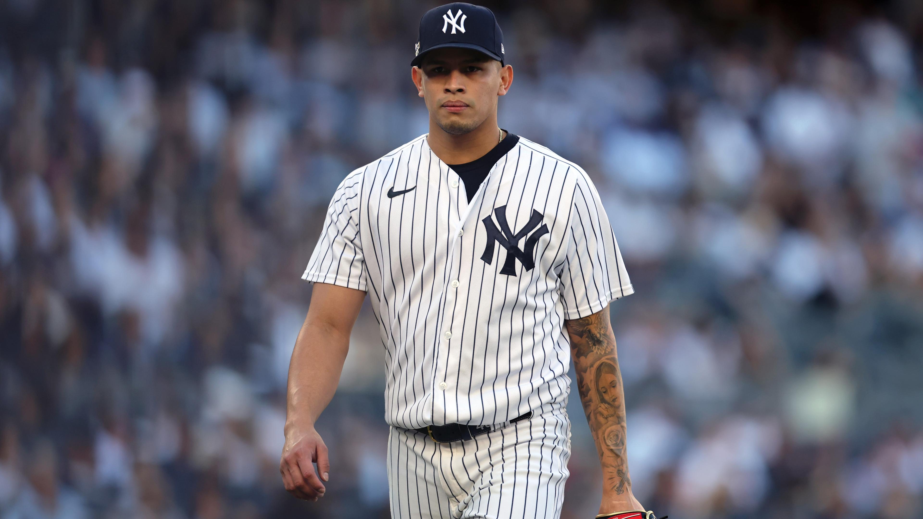 Oct 14, 2022; Bronx, New York, USA; New York Yankees relief pitcher Jonathan Loaisiga (43) walks off the field after being taken out of the game against the Cleveland Guardians during the eighth inning in game two of the ALDS for the 2022 MLB Playoffs at Yankee Stadium. Mandatory Credit: Brad Penner-USA TODAY Sports