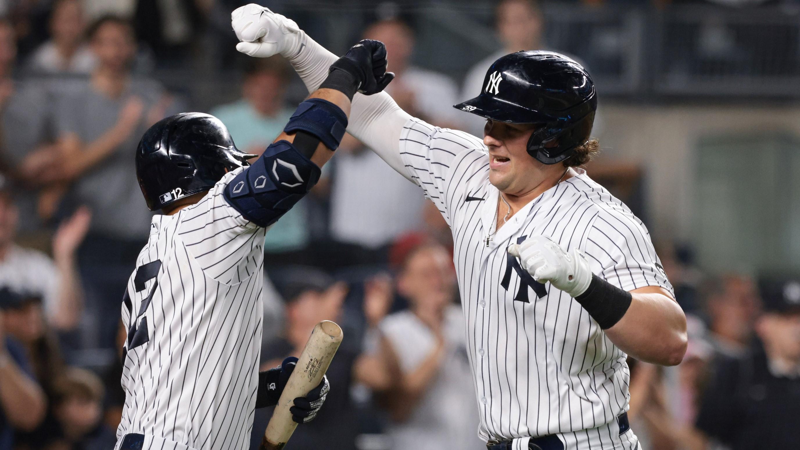 Aug 20, 2021; Bronx, New York, USA; New York Yankees first baseman Luke Voit (59) celebrates with second baseman Rougned Odor (12) after hitting a solo home run during the seventh inning against the Minnesota Twins at Yankee Stadium.