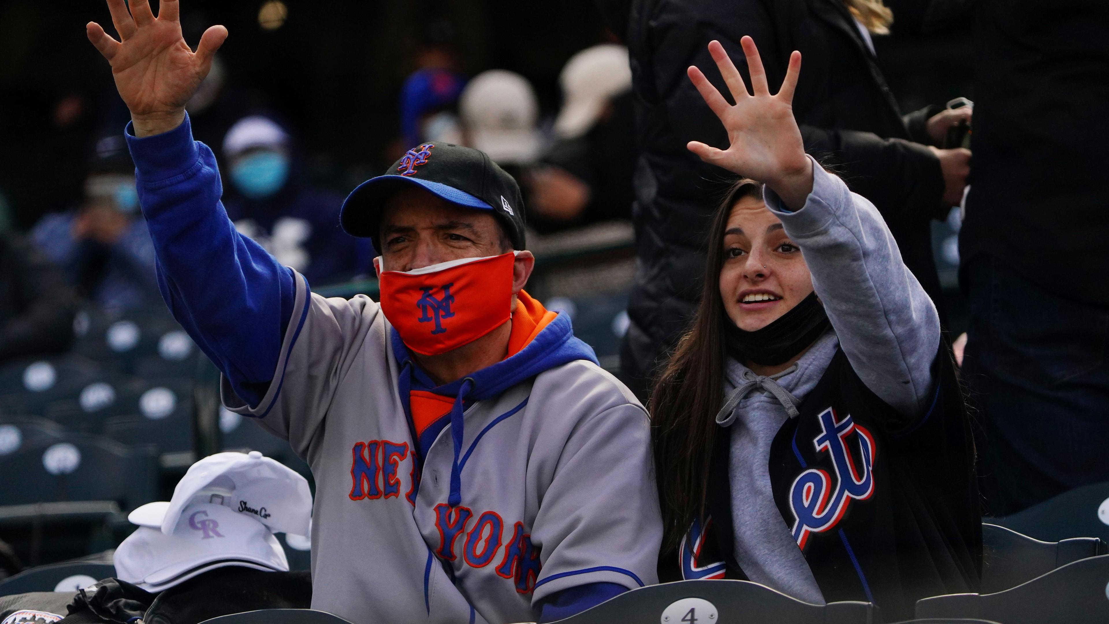 New York Mets fans cheer before the game against the Colorado Rockies at Coors Field.