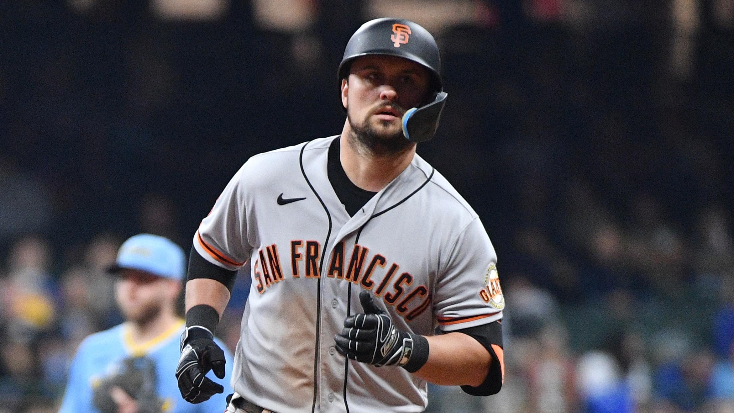 May 26, 2023; Milwaukee, Wisconsin, USA; San Francisco Giants third baseman J.D. Davis (7) rounds the bases after hitting a home run against the Milwaukee Brewers in the seventh inning at American Family Field.