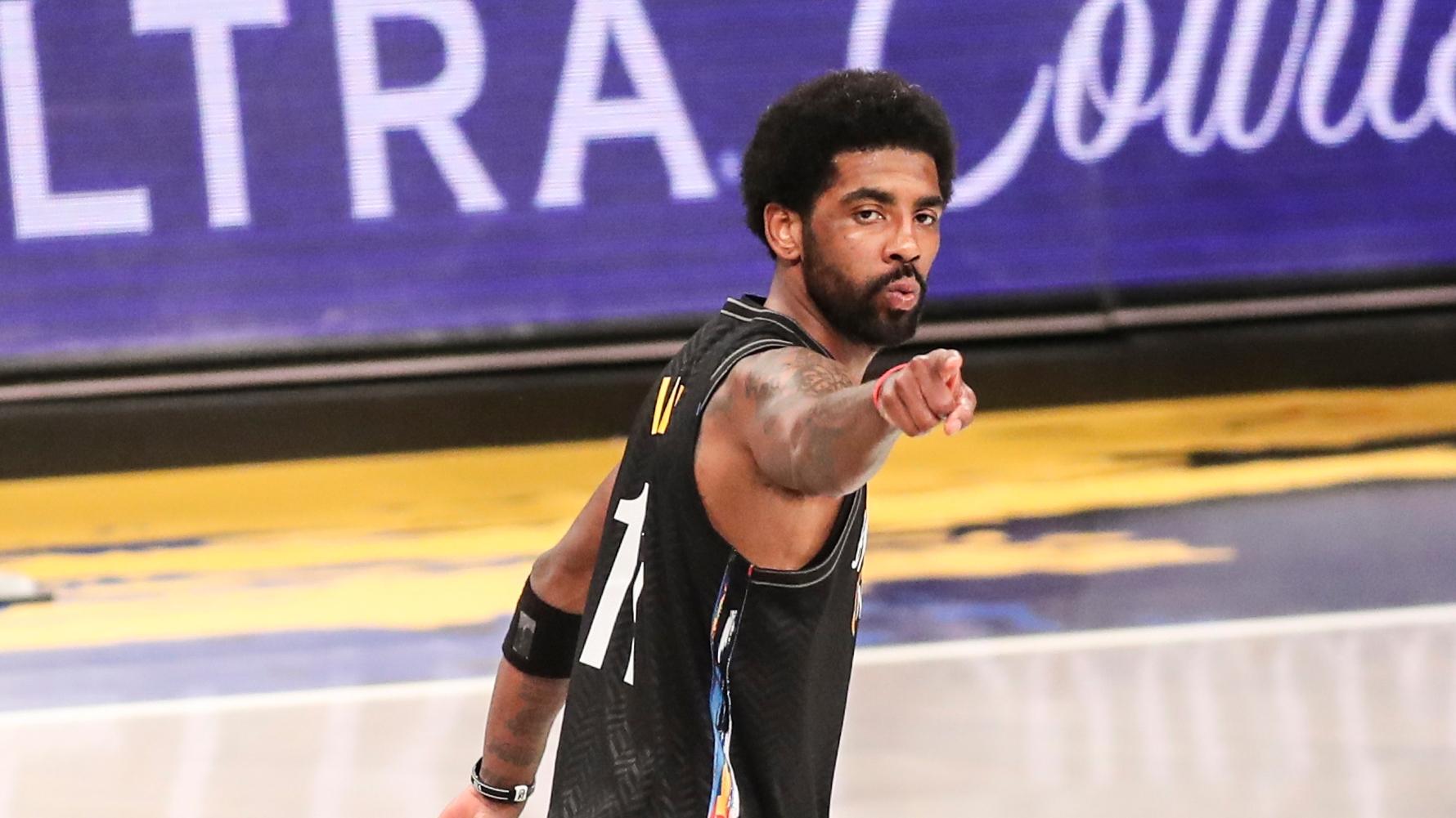 Jun 7, 2021; Brooklyn, New York, USA; Brooklyn Nets guard Kyrie Irving (11) points to the crowd after making a three point shot in the fourth quarter against the Milwaukee Bucks during game two in the second round of the 2021 NBA Playoffs. at Barclays Center. Mandatory Credit: Wendell Cruz-USA TODAY Sports