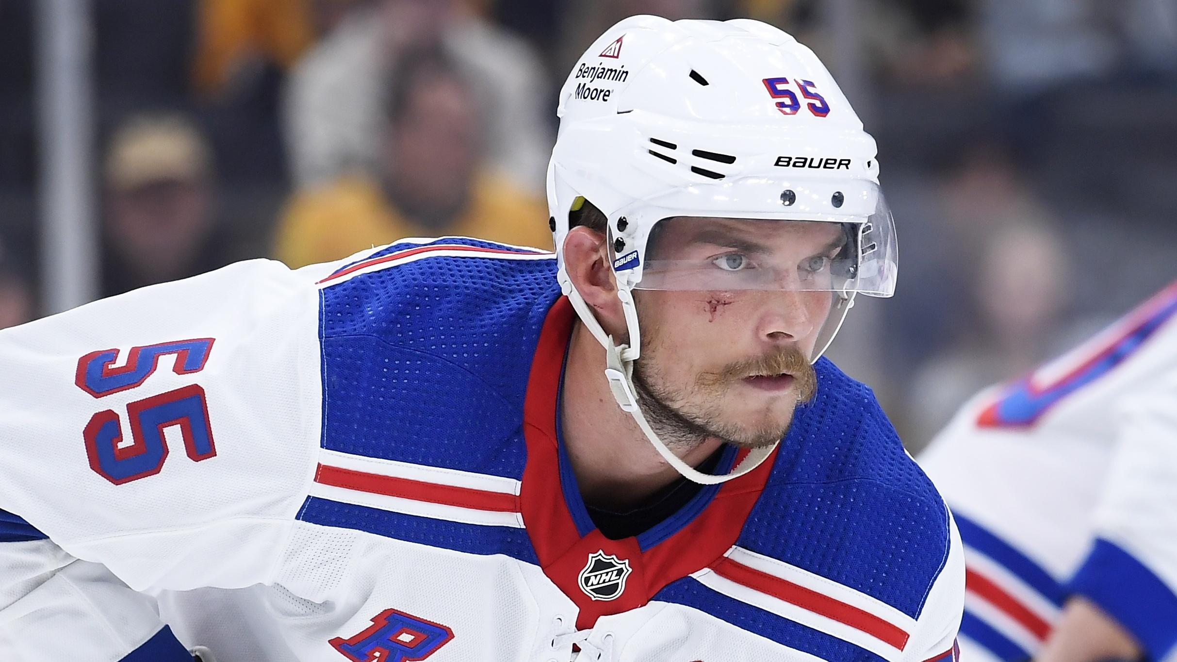 New York Rangers defenseman Ryan Lindgren (55) gets set for a face-off during the third period against the Boston Bruins at TD Garden. 