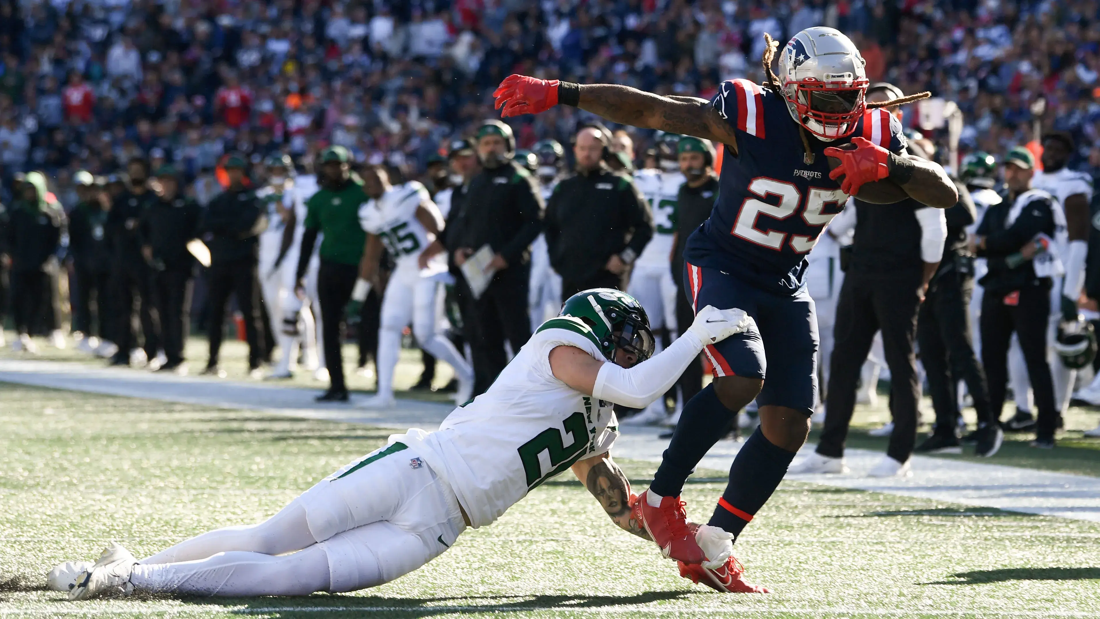 Oct 24, 2021; Foxborough, Massachusetts, USA; New York Jets safety Ashtyn Davis (21) takes New England Patriots running back Brandon Bolden (25) during the first half at Gillette Stadium. Mandatory Credit: Brian Fluharty-USA TODAY Sports / Brian Fluharty-USA TODAY Sports