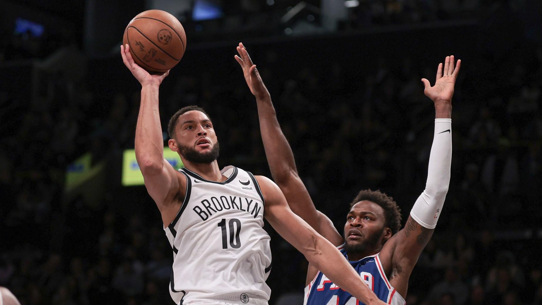 Oct 16, 2023; Brooklyn, New York, USA; Brooklyn Nets guard Ben Simmons (10) shoots the ball as Philadelphia 76ers forward Paul Reed (44) defends during the second half at Barclays Center.