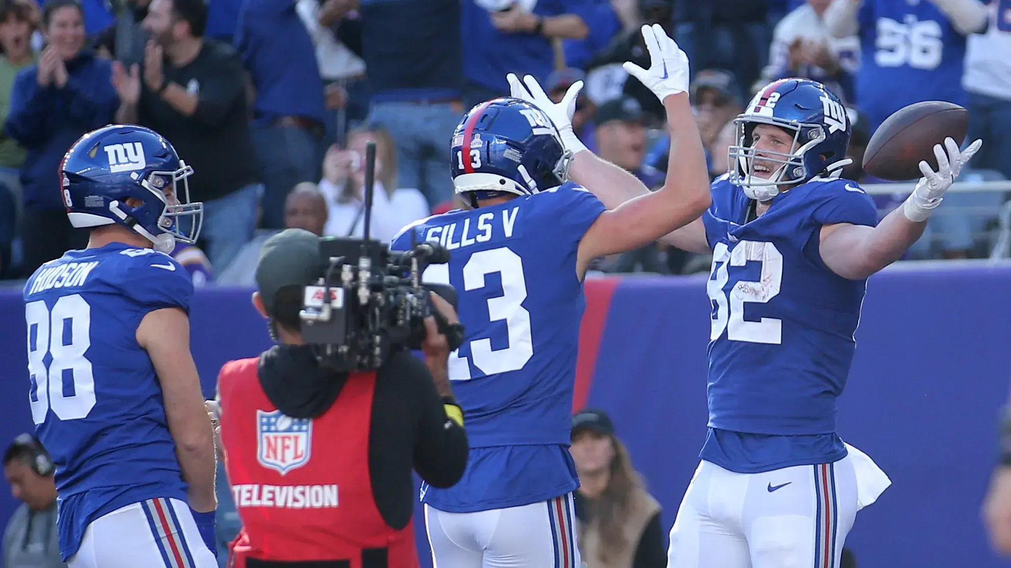 Oct 16, 2022; East Rutherford, New Jersey, USA; New York Giants tight end Daniel Bellinger (82) celebrates his touchdown against the Baltimore Ravens with tight end Tanner Hudson (88) and wide receiver David Sills V (13) during the fourth quarter at MetLife Stadium. Mandatory Credit: Brad Penner-USA TODAY Sports / © Brad Penner-USA TODAY Sports