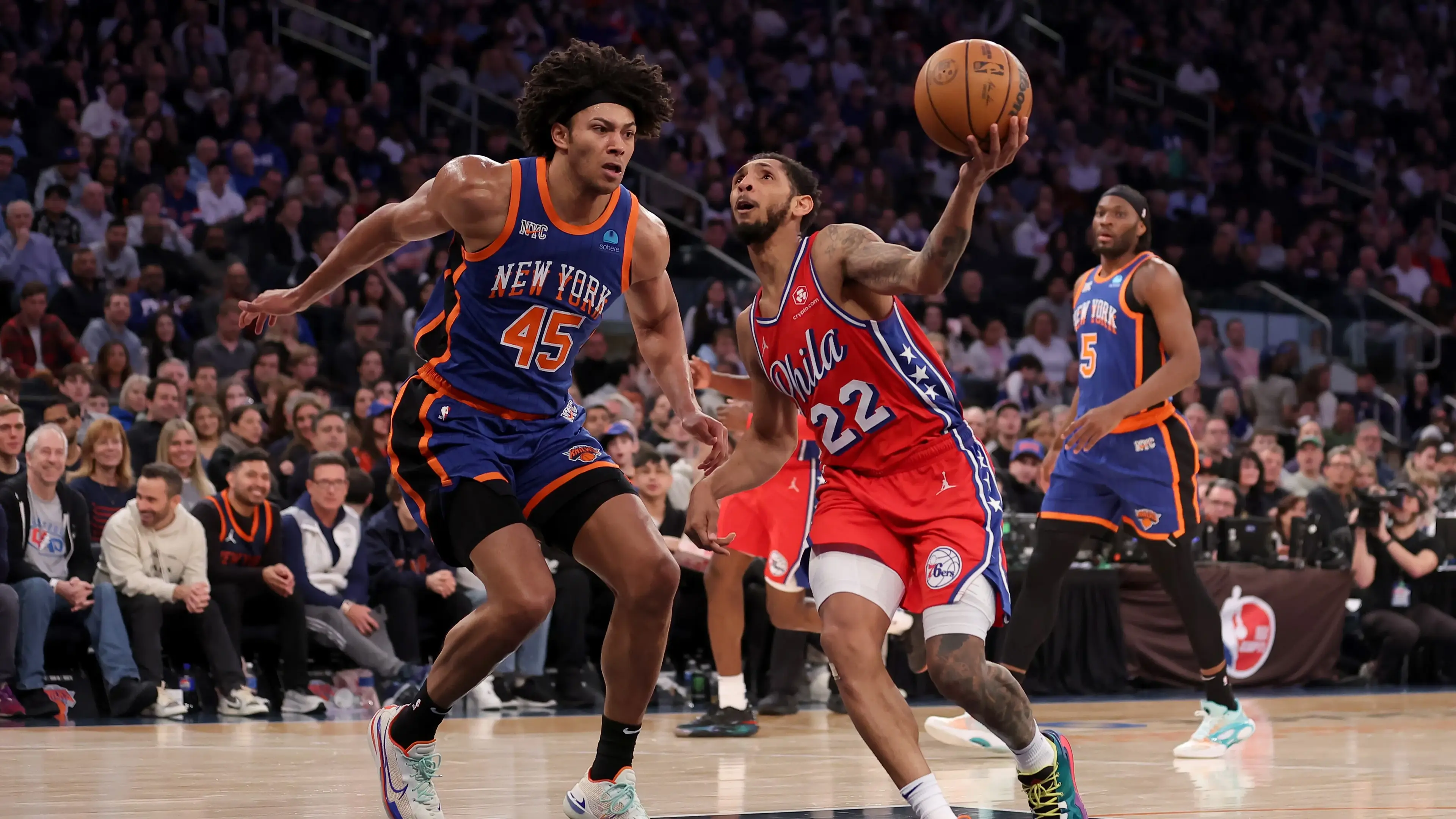 Mar 10, 2024; New York, New York, USA; Philadelphia 76ers guard Cameron Payne (22) drives to the basket against New York Knicks center Jericho Sims (45) and forward Precious Achiuwa (5) during the second quarter at Madison Square Garden. Mandatory Credit: Brad Penner-Imagn Images / © Brad Penner-Imagn Images