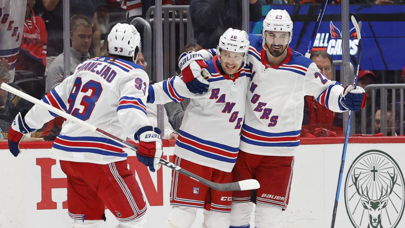 Apr 28, 2024; Washington, District of Columbia, USA; New York Rangers left wing Artemi Panarin (10) celebrates with teammates after scoring a goal against the Washington Capitals in the third period in game four of the first round of the 2024 Stanley Cup Playoffs at Capital One Arena. Mandatory Credit: Geoff Burke-USA TODAY Sports